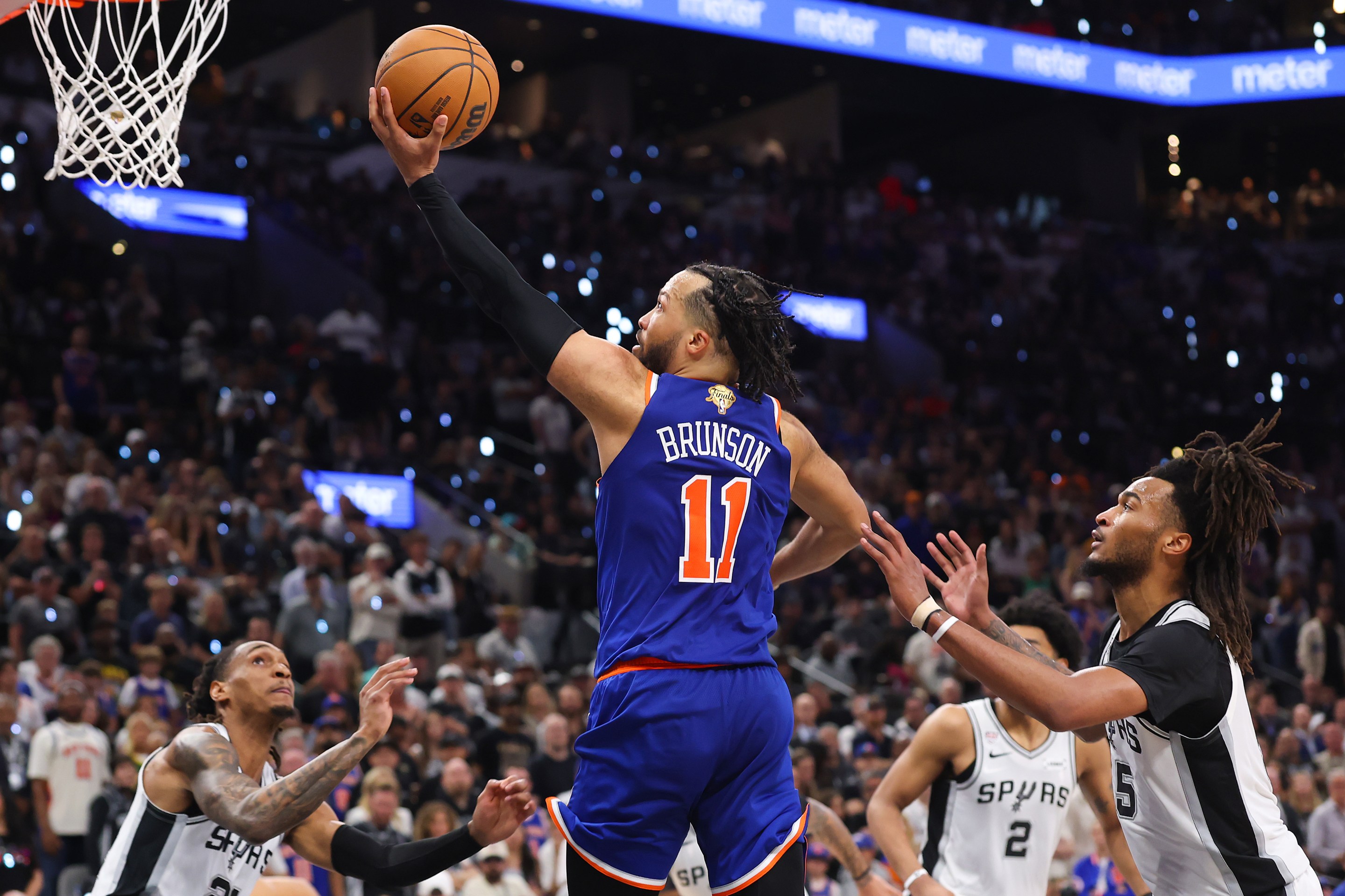 SAN ANTONIO, TEXAS - JUNE 13: Jalen Brunson #11 of the New York Knicks shoots the ball past Stephon Castle #5 of the San Antonio Spurs during the fourth quarter in Game Five of the 2026 NBA Finals at Frost Bank Center on June 13, 2026 in San Antonio, Texas. NOTE TO USER: User expressly acknowledges and agrees that, by downloading and or using this photograph, User is consenting to the terms and conditions of the Getty Images License Agreement. (Photo by Gregory Shamus/Getty Images)