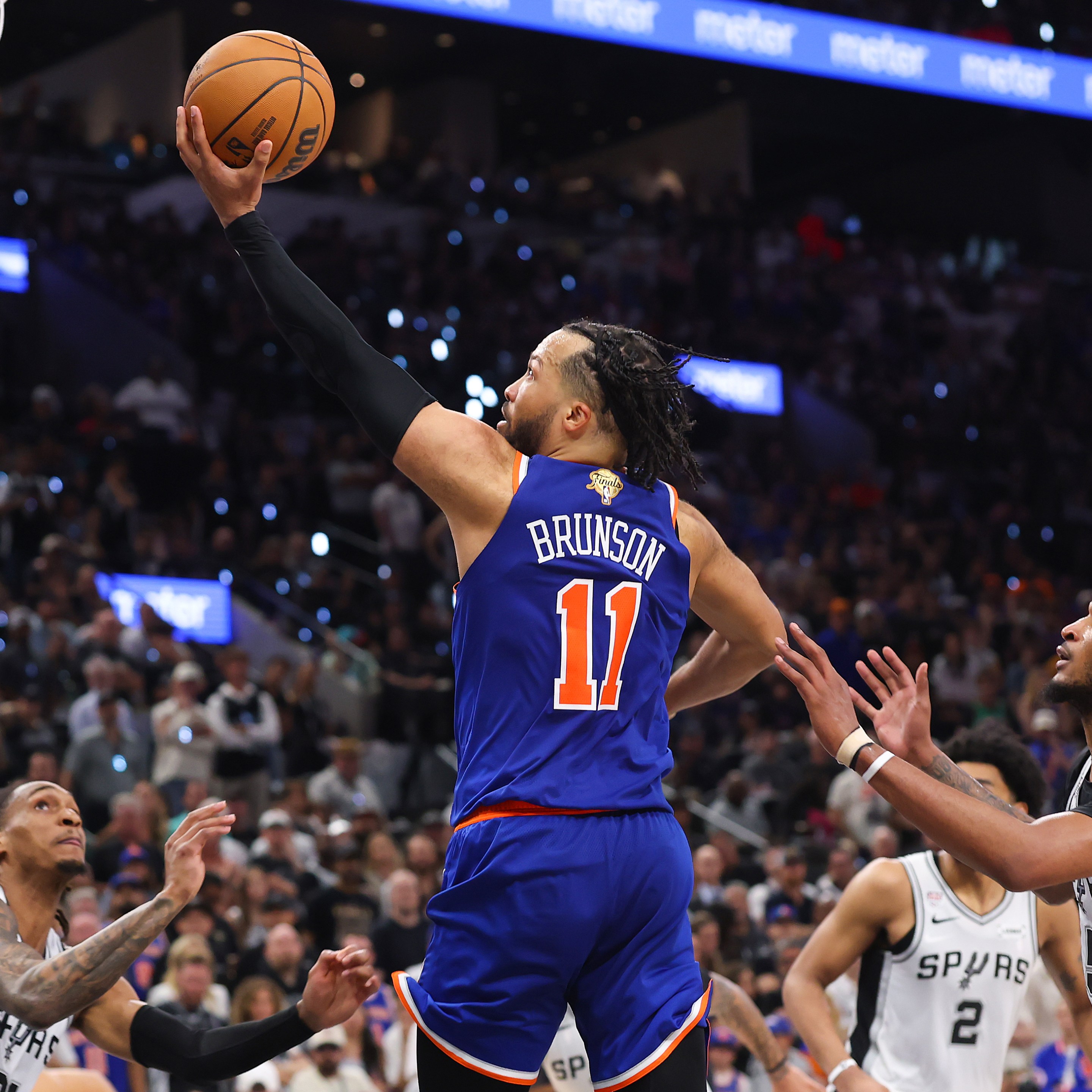 SAN ANTONIO, TEXAS - JUNE 13: Jalen Brunson #11 of the New York Knicks shoots the ball past Stephon Castle #5 of the San Antonio Spurs during the fourth quarter in Game Five of the 2026 NBA Finals at Frost Bank Center on June 13, 2026 in San Antonio, Texas. NOTE TO USER: User expressly acknowledges and agrees that, by downloading and or using this photograph, User is consenting to the terms and conditions of the Getty Images License Agreement. (Photo by Gregory Shamus/Getty Images)