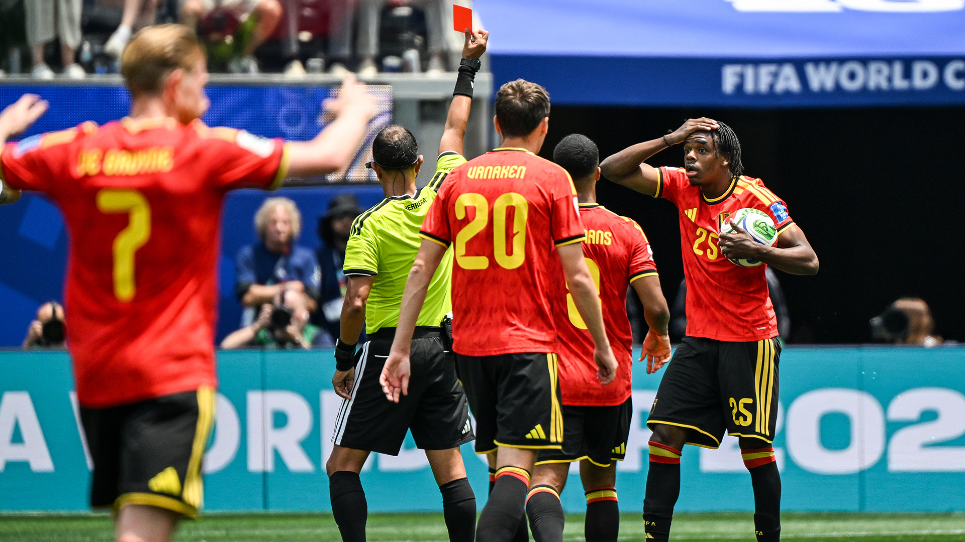 Nathan Ngoy #25 of Belgium receives a red card during the FIFA World Cup 2026 Group G match between Belgium and IR Iran at Los Angeles Stadium on June 21, 2026 in Los Angeles, California