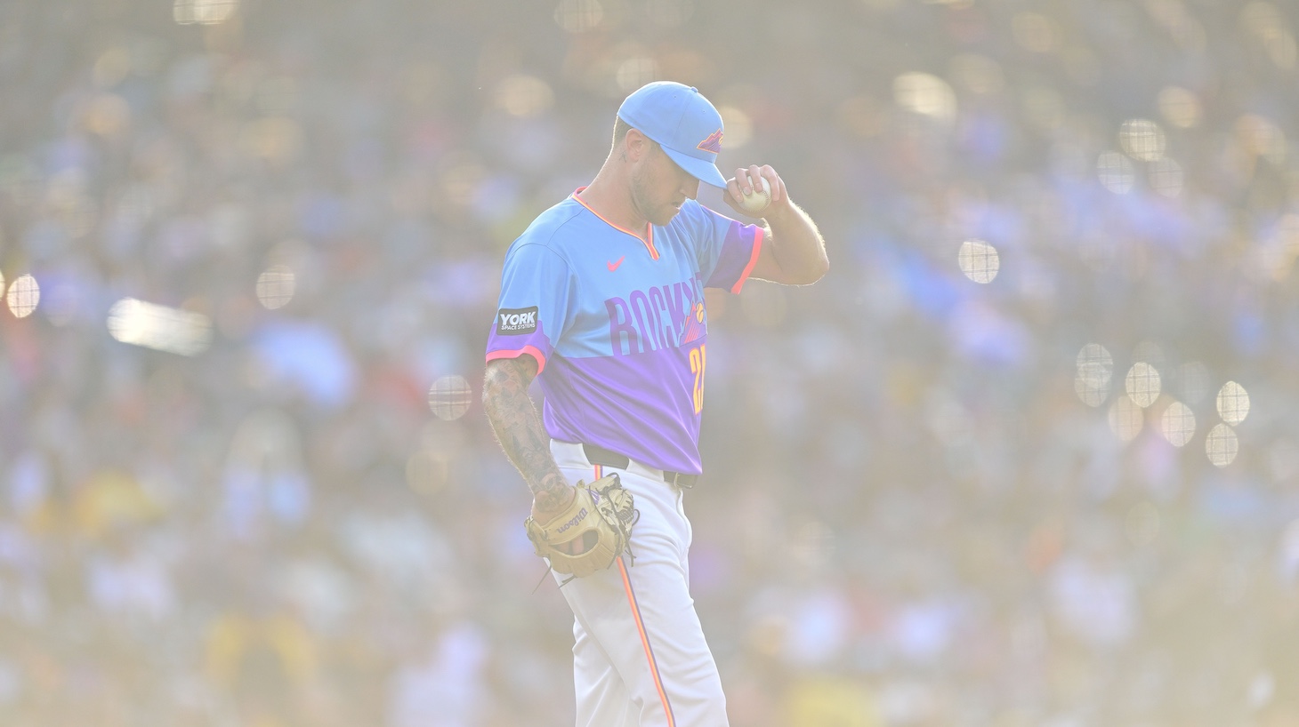 Kyle Freeland of the Colorado Rockies takes a moment as he pitches in the third inning against the Pittsburgh Pirates at Coors Field on June 19, 2026.