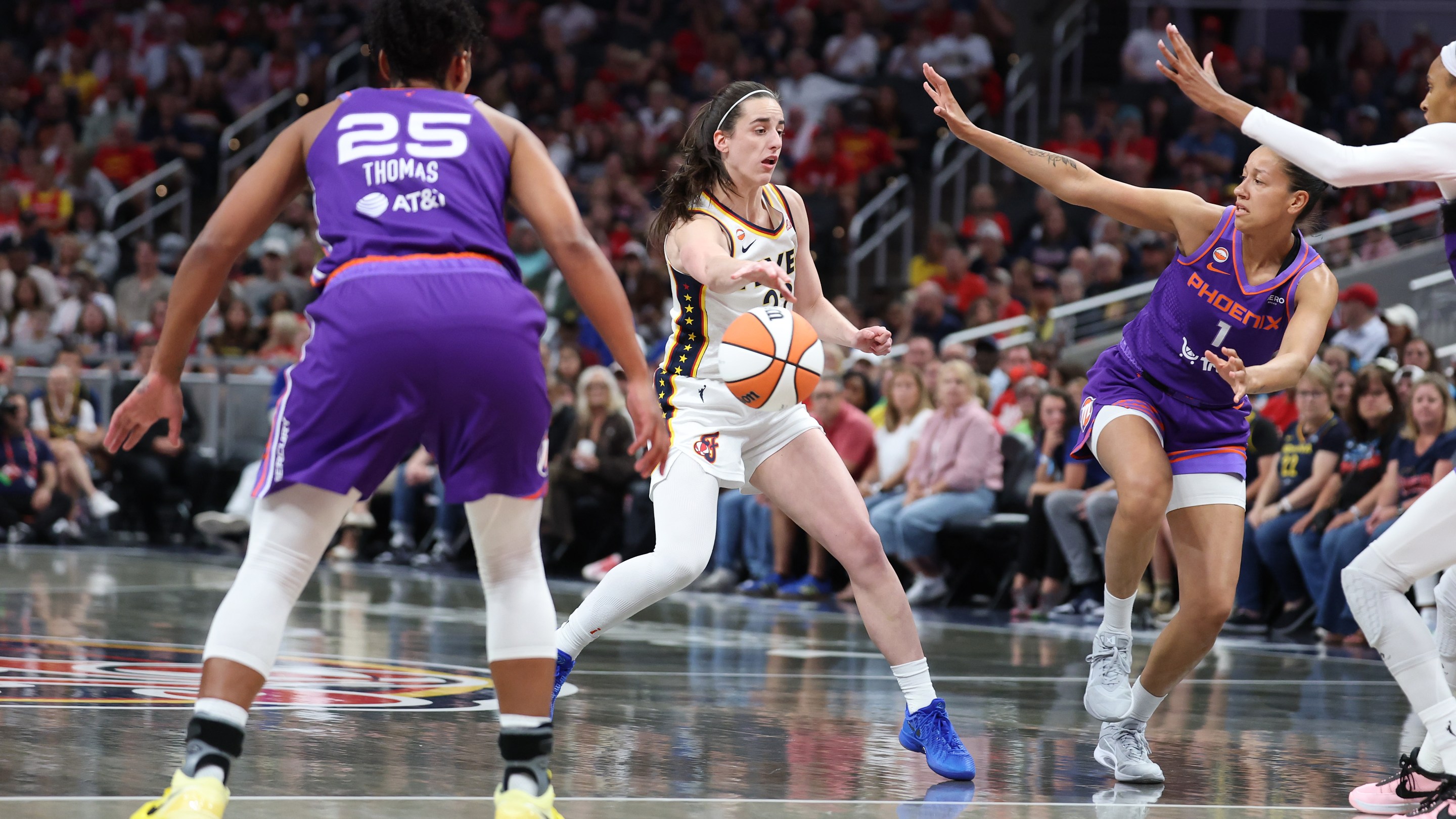 Caitlin Clark #22 of the Indiana Fever passes the ball during the game against the Phoenix Mercury at Gainbridge Fieldhouse on June 24, 2026 in Indianapolis, Indiana.