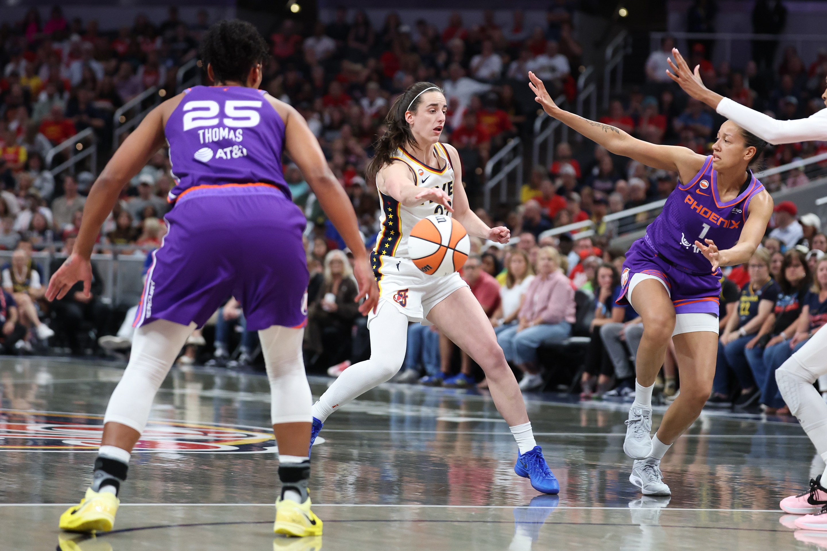 Caitlin Clark #22 of the Indiana Fever passes the ball during the game against the Phoenix Mercury at Gainbridge Fieldhouse on June 24, 2026 in Indianapolis, Indiana.
