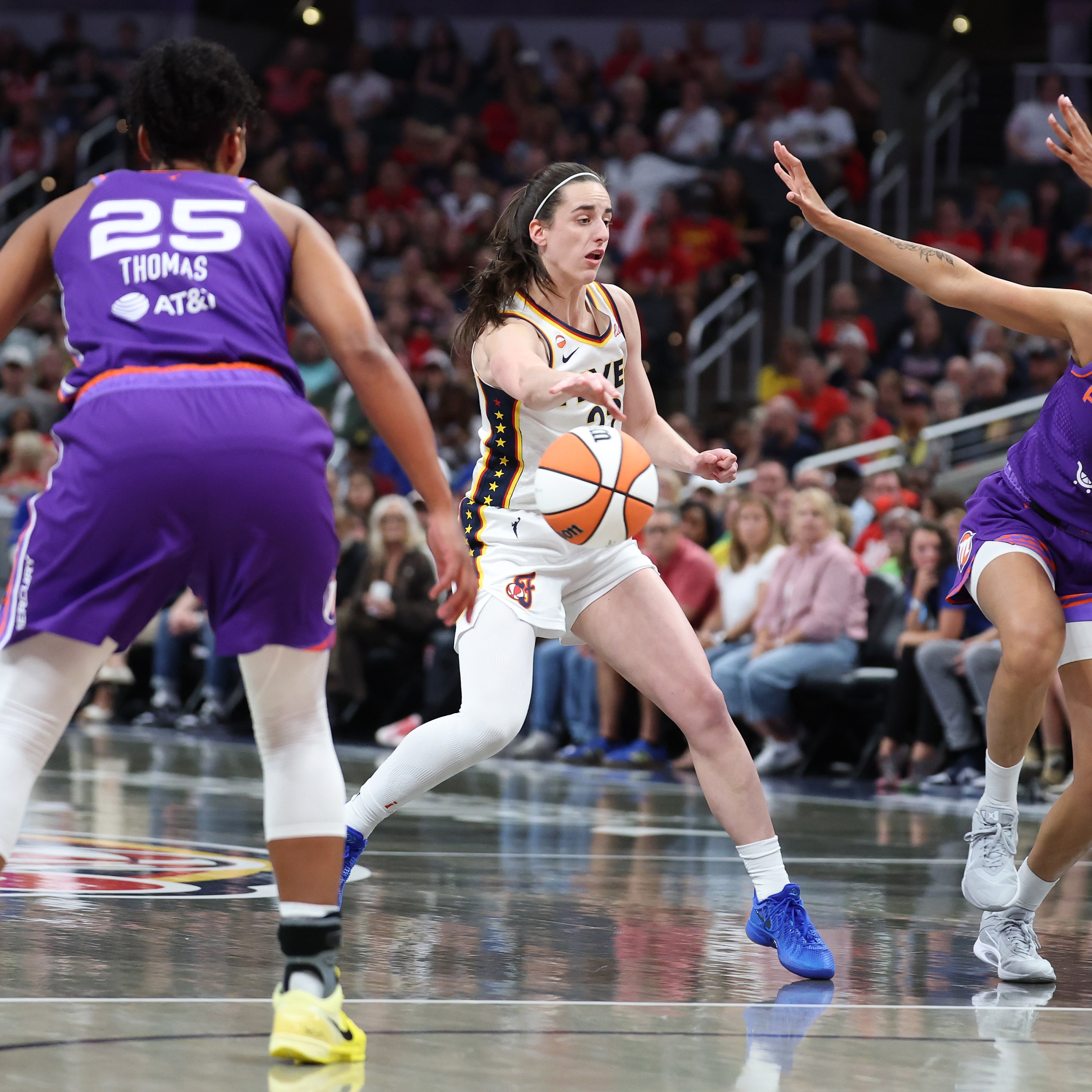 Caitlin Clark #22 of the Indiana Fever passes the ball during the game against the Phoenix Mercury at Gainbridge Fieldhouse on June 24, 2026 in Indianapolis, Indiana.