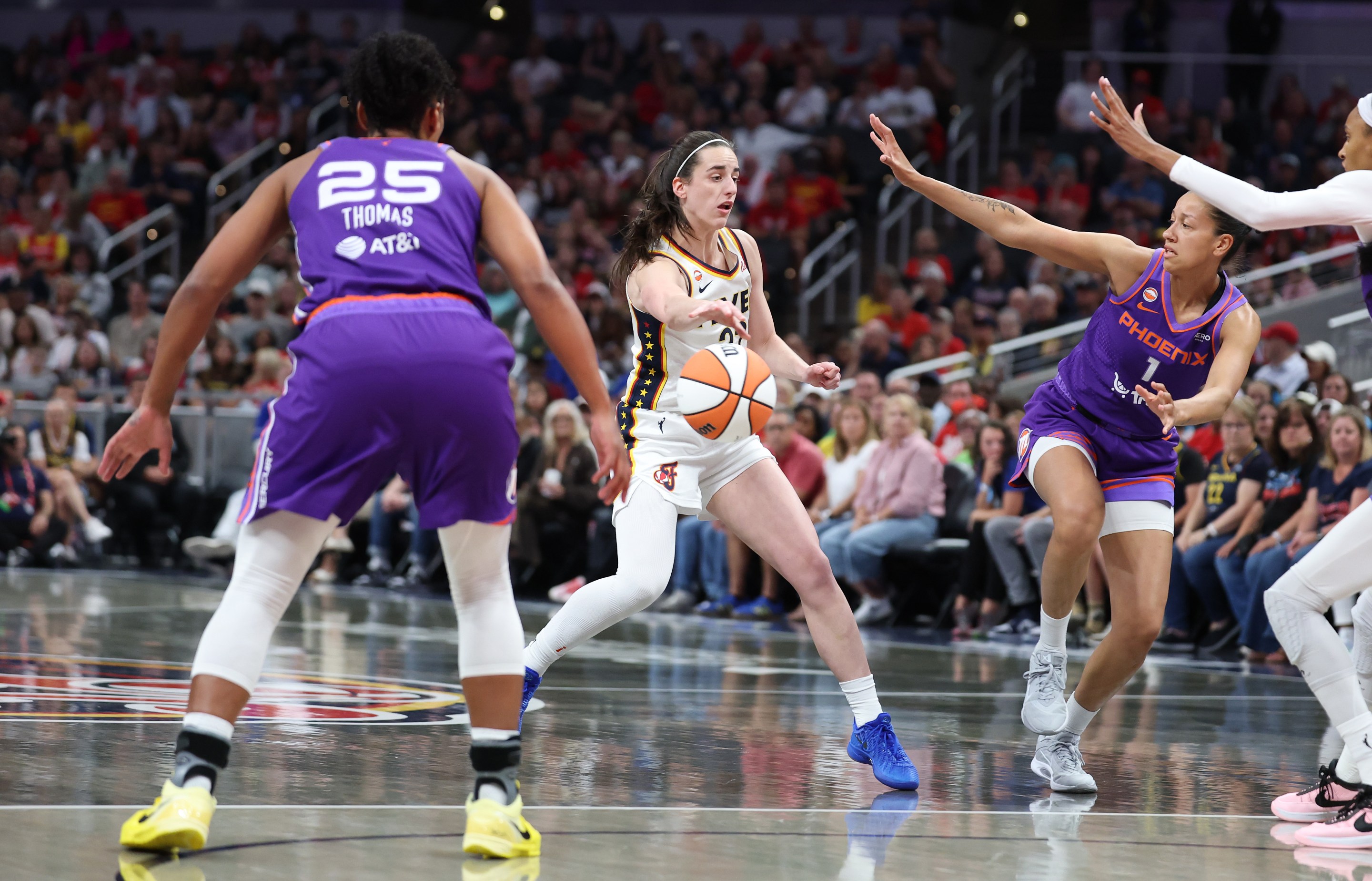 Caitlin Clark #22 of the Indiana Fever passes the ball during the game against the Phoenix Mercury at Gainbridge Fieldhouse on June 24, 2026 in Indianapolis, Indiana.