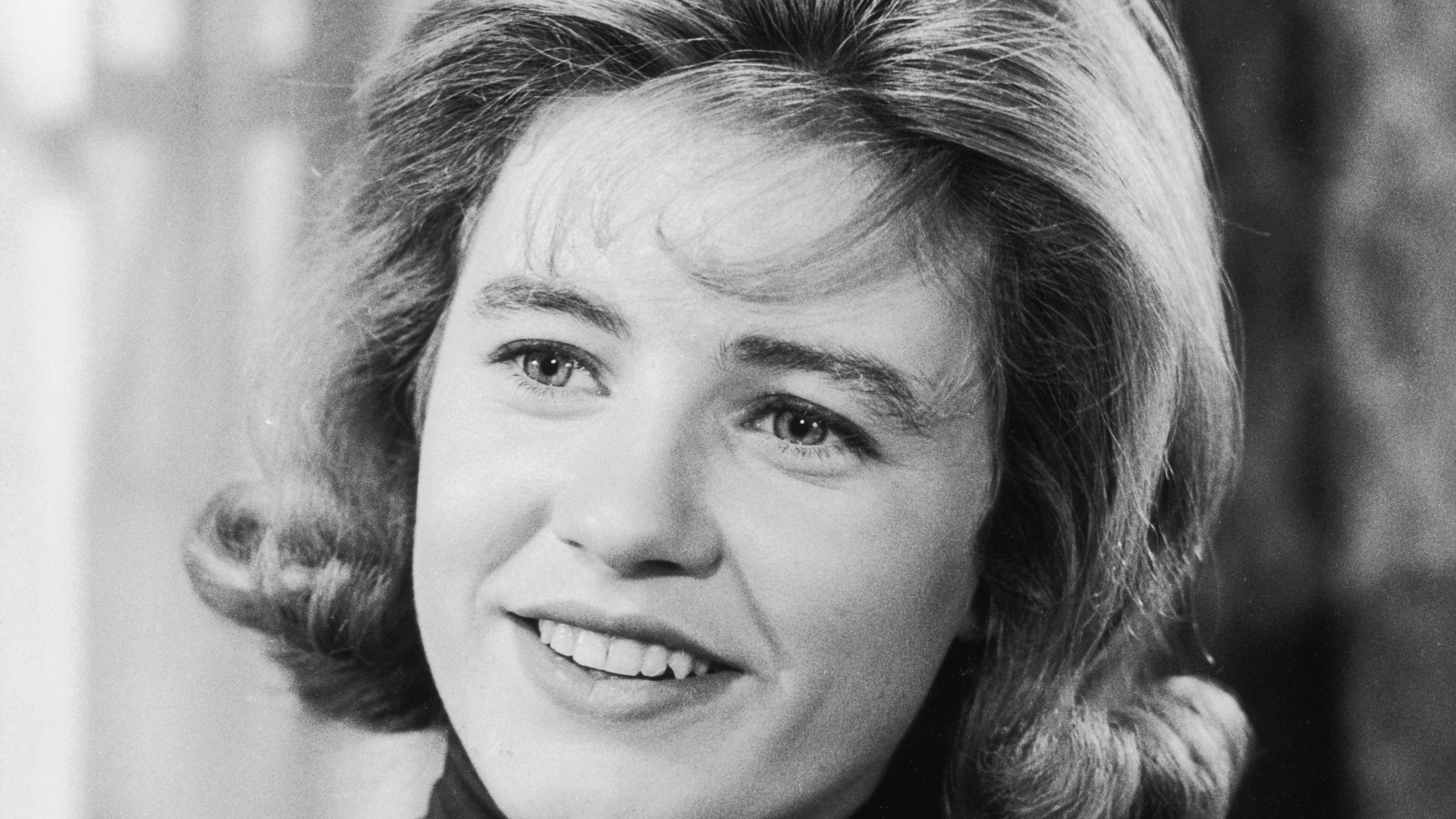 Closeup of American actor Patty Duke smiling in a still from the television series 'The Patty Duke Show'.