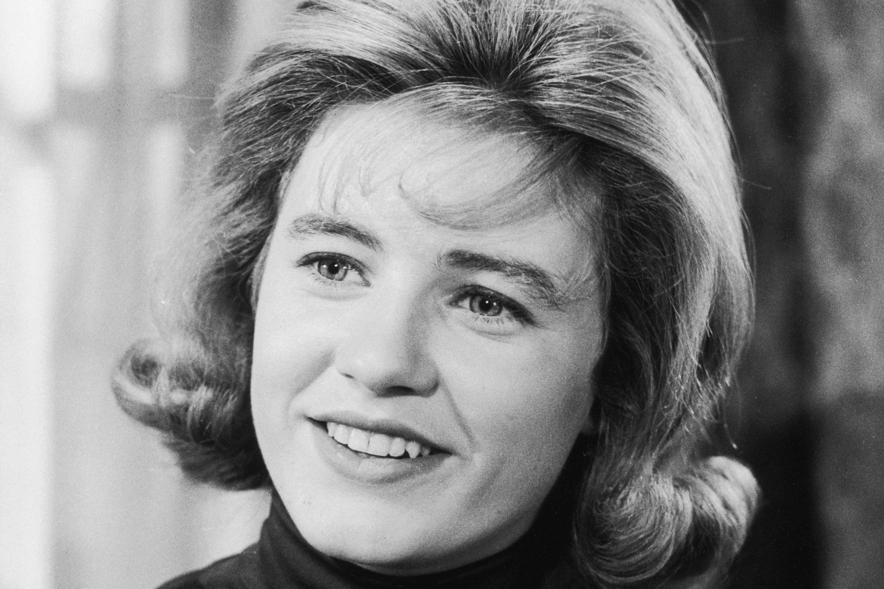 Closeup of American actor Patty Duke smiling in a still from the television series 'The Patty Duke Show'.