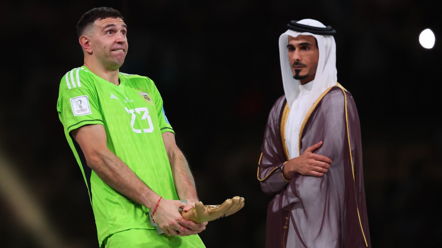 Emiliano Martinez of Argentina gestures with his Golden glove award during the FIFA World Cup Qatar 2022 Final match between Argentina and France on December 18, 2022 in Lusail City, Qatar.