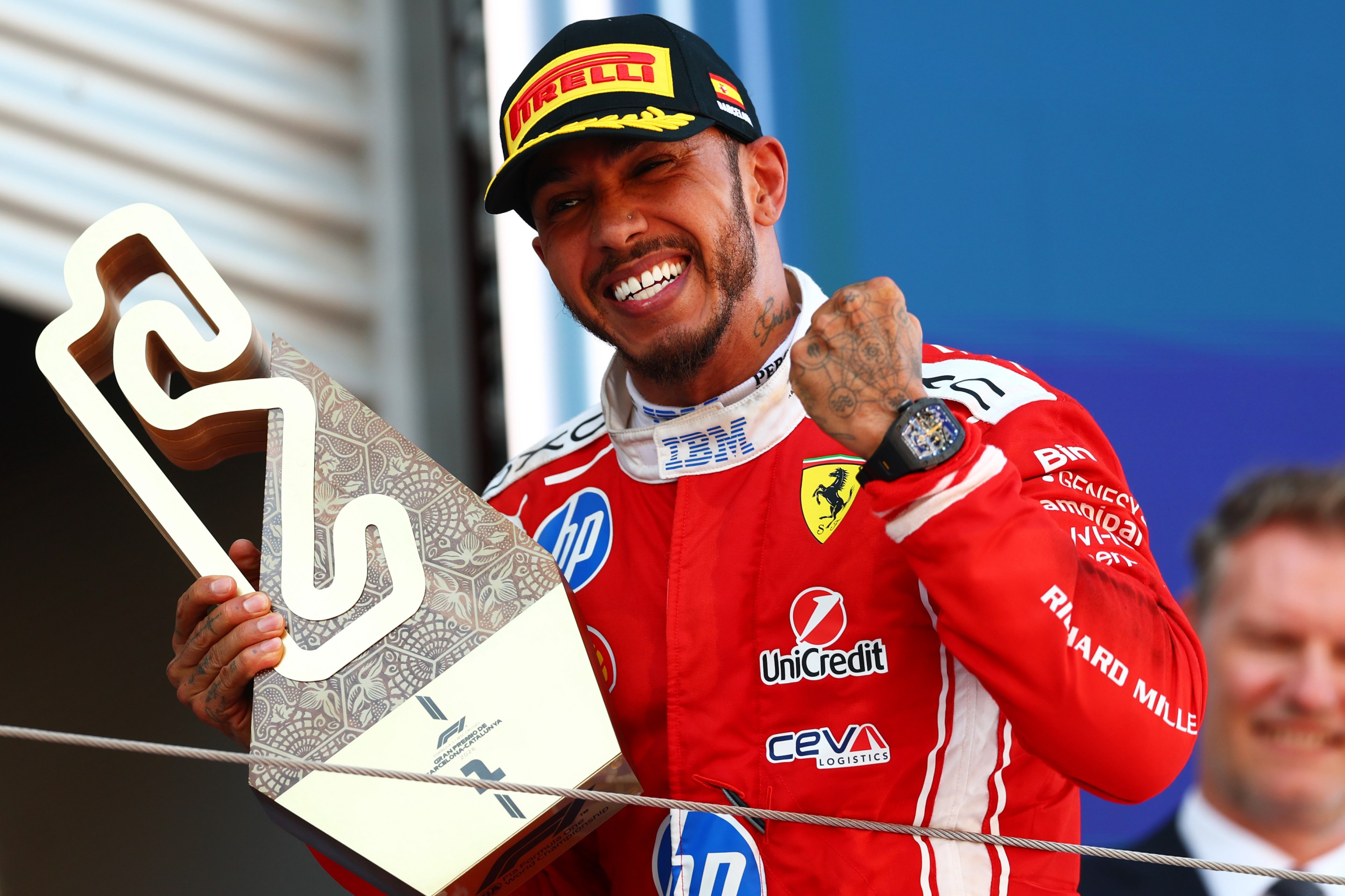 Race winner Lewis Hamilton of Great Britain and Scuderia Ferrari on the podium with his trophy during the F1 Grand Prix of Barcelona-Catalunya.