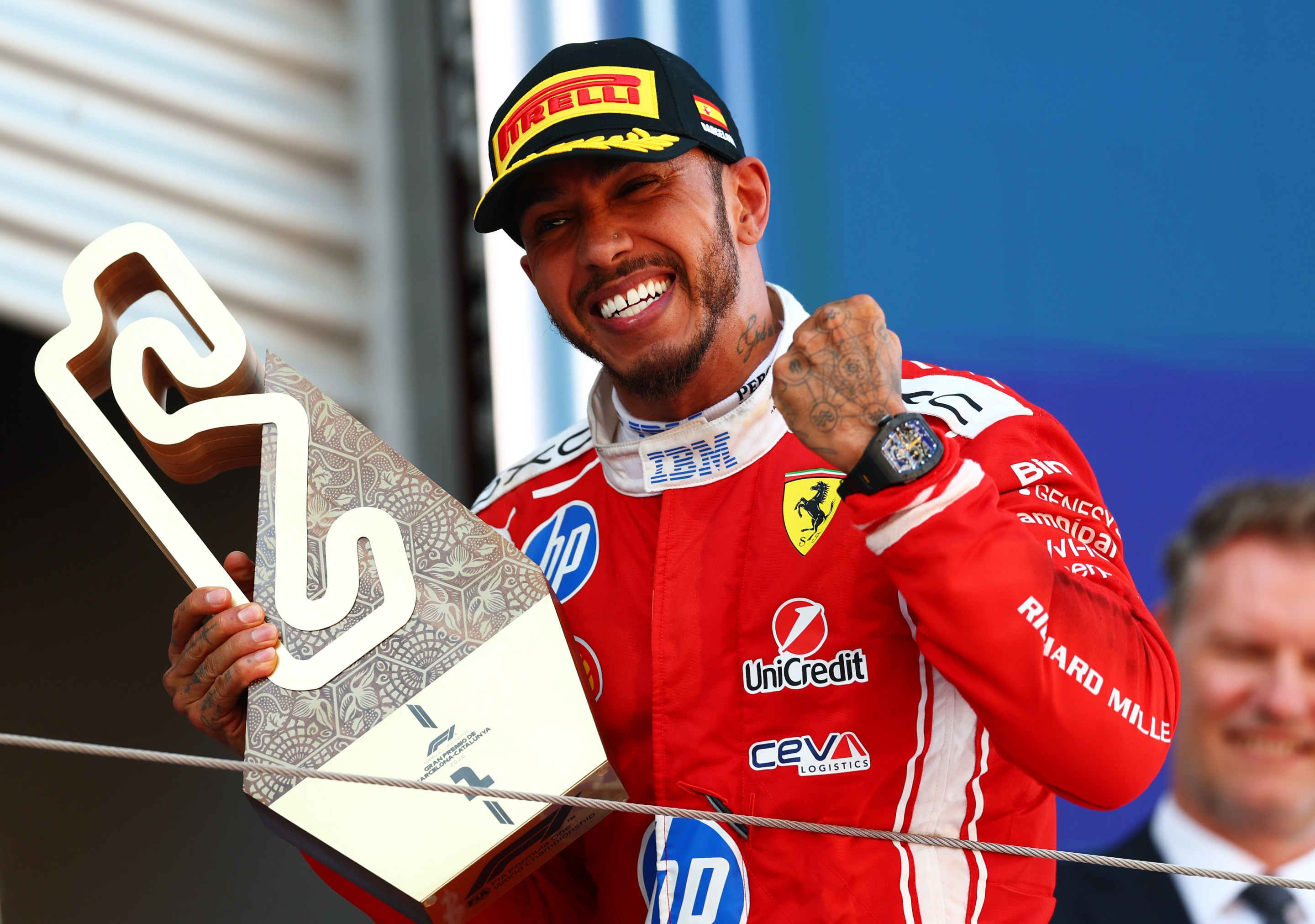 Race winner Lewis Hamilton of Great Britain and Scuderia Ferrari on the podium with his trophy during the F1 Grand Prix of Barcelona-Catalunya.