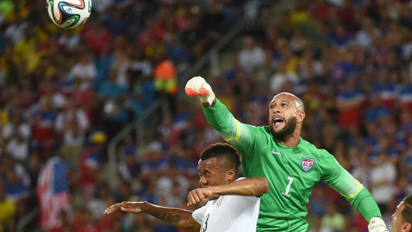 US goalkeeper Tim Howard vies with Ghana's forward Jordan Ayew during a Group G football match between Ghana and US during the 2014 FIFA World Cup on June 16, 2014.