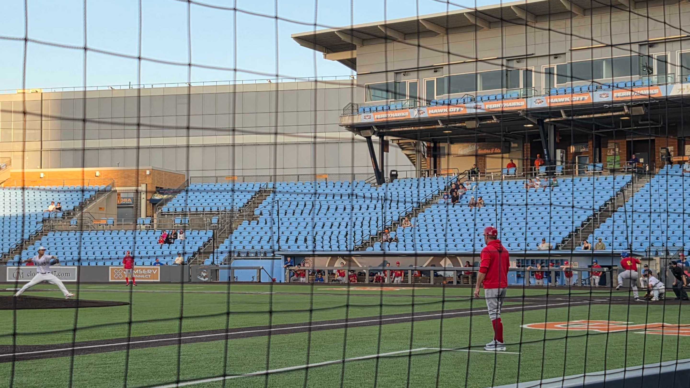 view of a mostly empty ballpark, from low on the third base side, at the FerryHawks play the Rockers