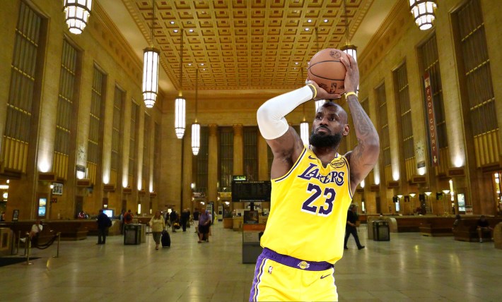 LeBron James shooting a basketball at Amtrak's 30th Street Station in Philadelphia, and
