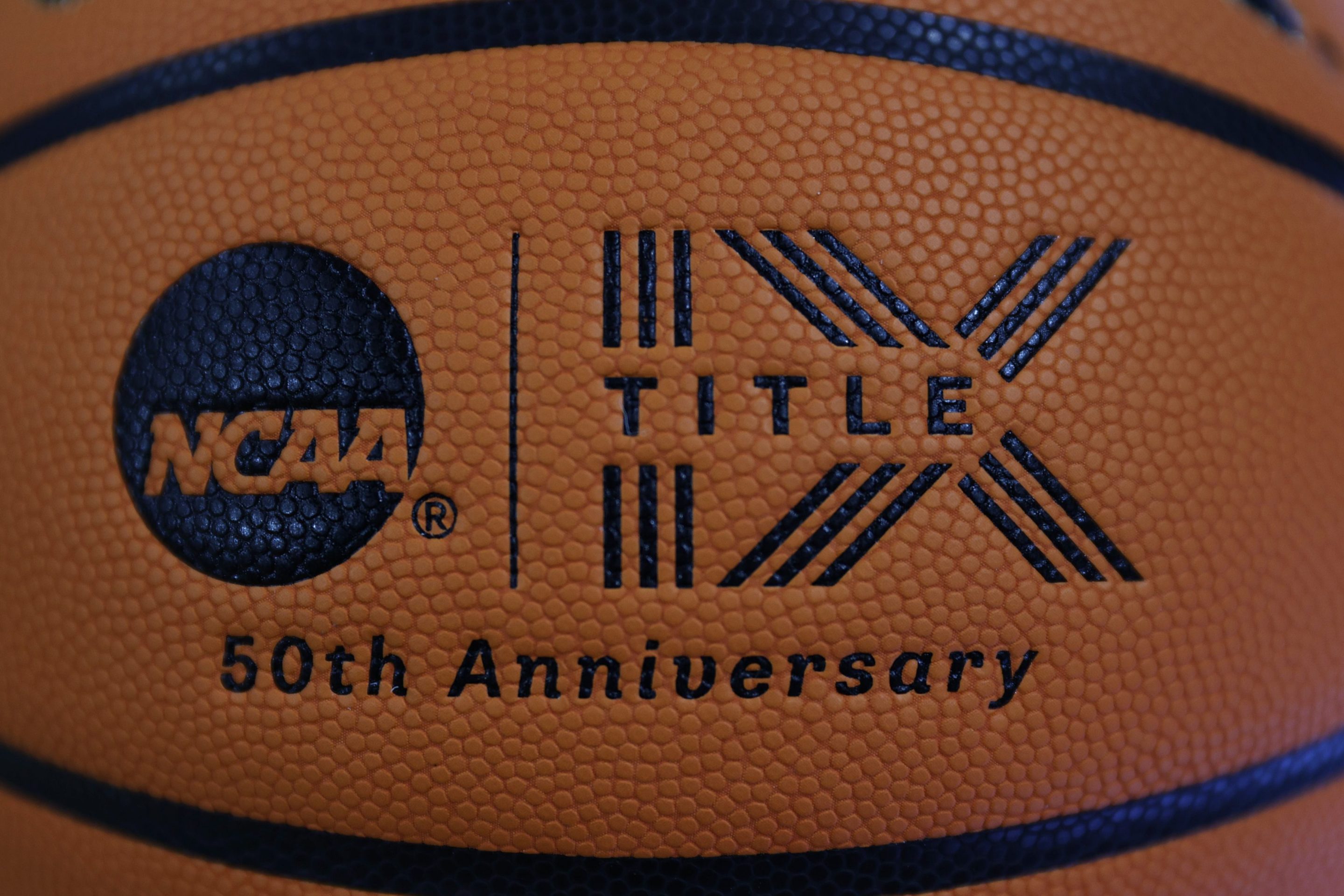 A detail of a Title IX logo on a basketball is seen before the Women's NCAA Basketball Tournament at Climate Pledge Arena on March 22, 2023 in Seattle, Washington.