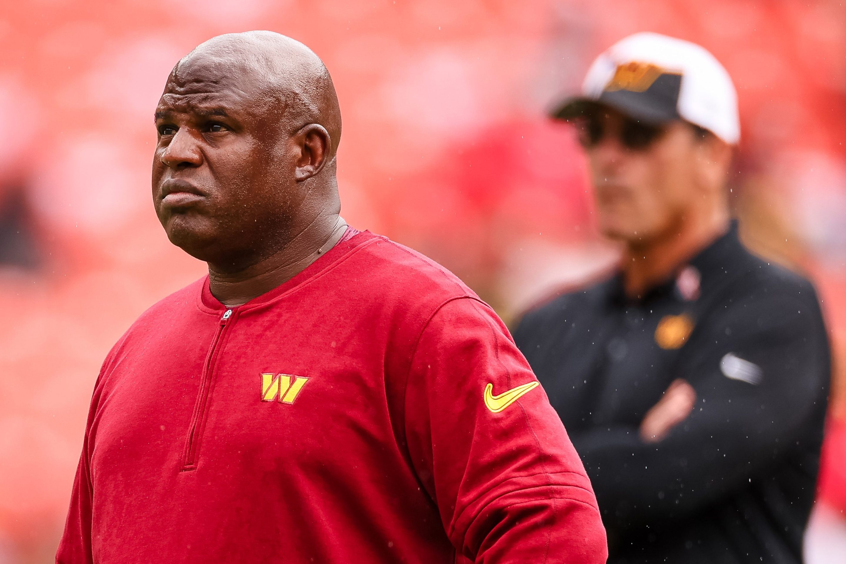 Assistant head coach and offensive coordinator Eric Bieniemy looks on as head coach Ron Rivera watches his team before the game against the Arizona Cardinals at FedExField on September 10, 2023 in Landover, Maryland.