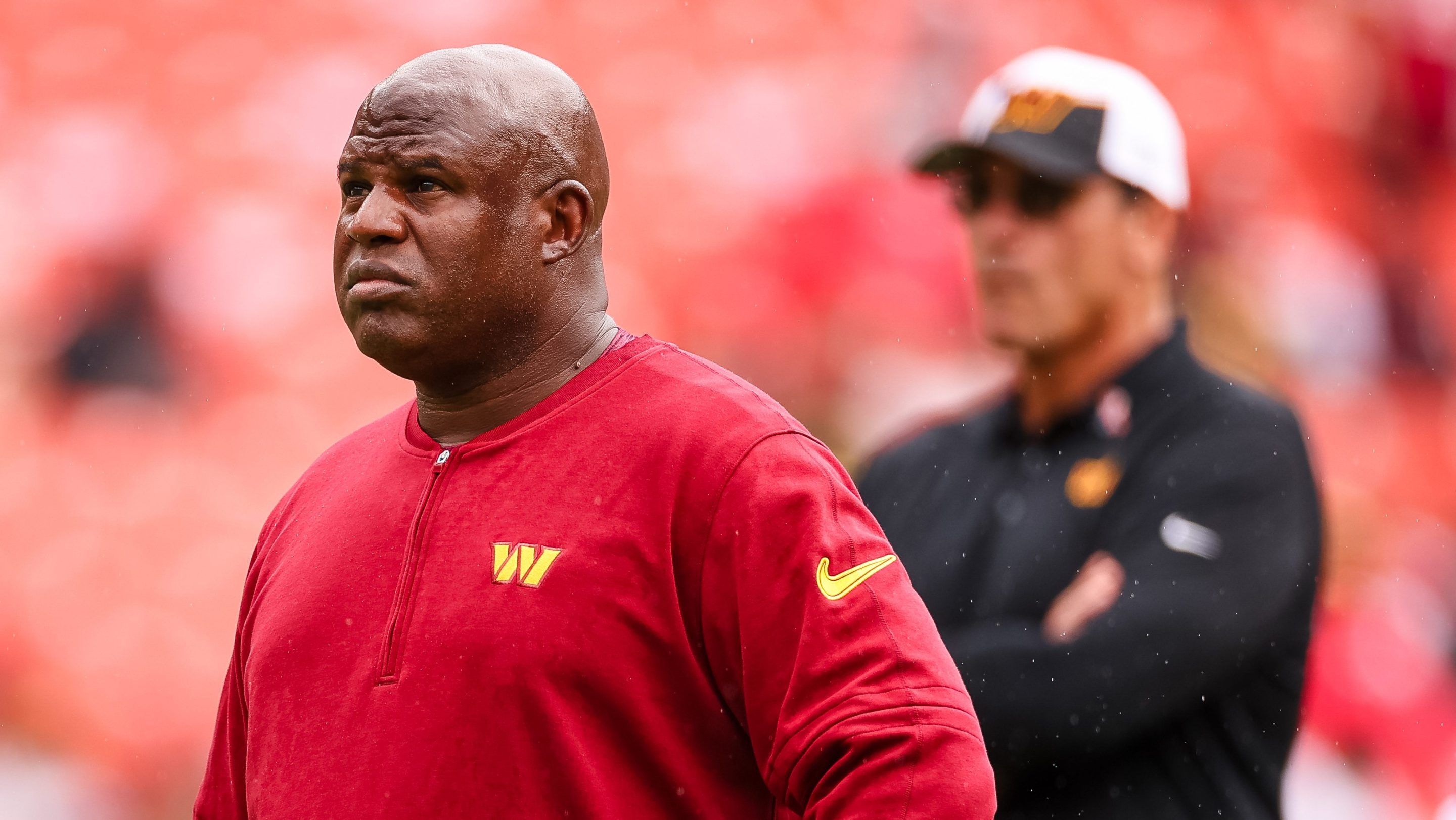 Assistant head coach and offensive coordinator Eric Bieniemy looks on as head coach Ron Rivera watches his team before the game against the Arizona Cardinals at FedExField on September 10, 2023 in Landover, Maryland.