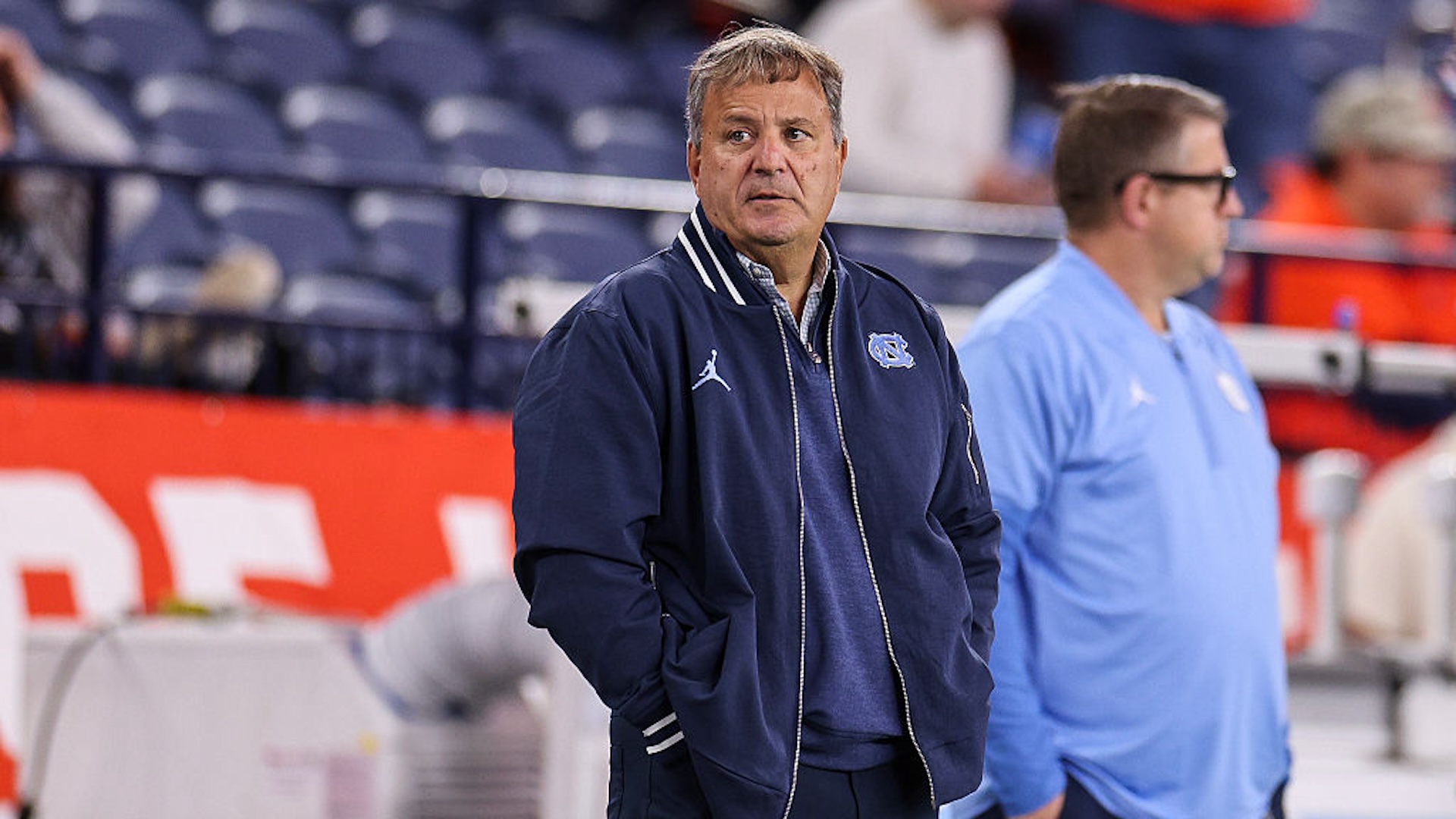 Mike Lombardi standing on the sidelines