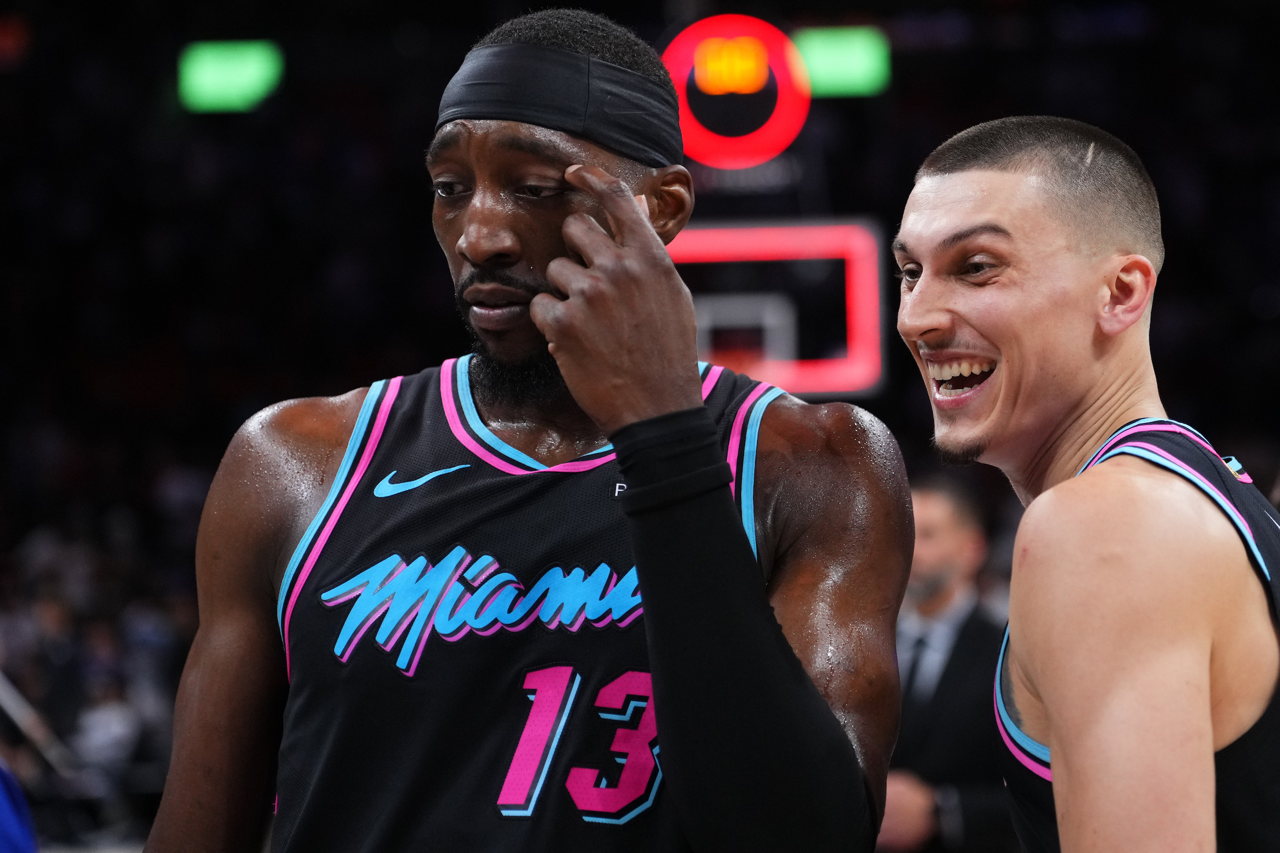 MIAMI, FLORIDA - MARCH 30: Bam Adebayo #13 and Tyler Herro #14 of the Miami Heat look on at the end of a game against the Philadelphia 76ers at Kaseya Center on March 30, 2026 in Miami, Florida. NOTE TO USER: User expressly acknowledges and agrees that, by downloading and or using this photograph, User is consenting to the terms and conditions of the Getty Images License Agreement. (Photo by Rich Storry/Getty Images)
