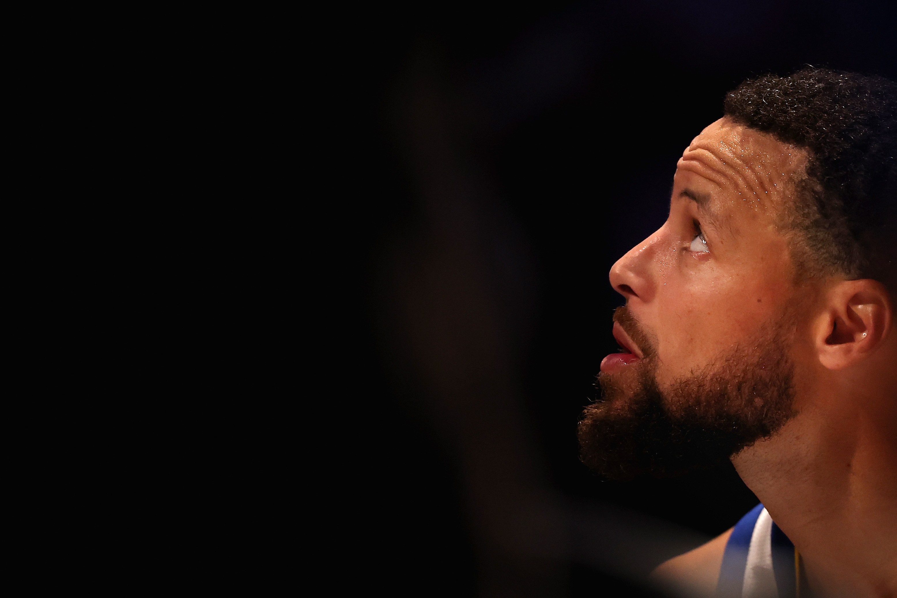 Stephen Curry of the Golden State Warriors sits on the bench during the second half of an NBA play-in tournament game on April 17, 2026.