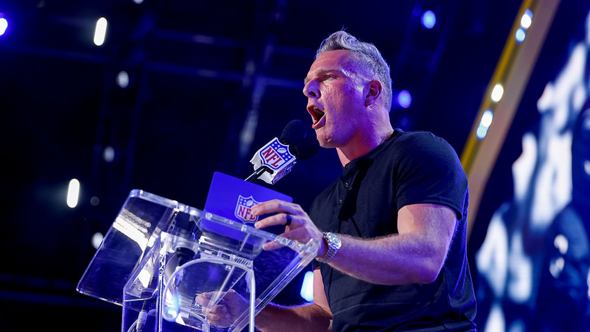 Pat McAfee yelling into a mic