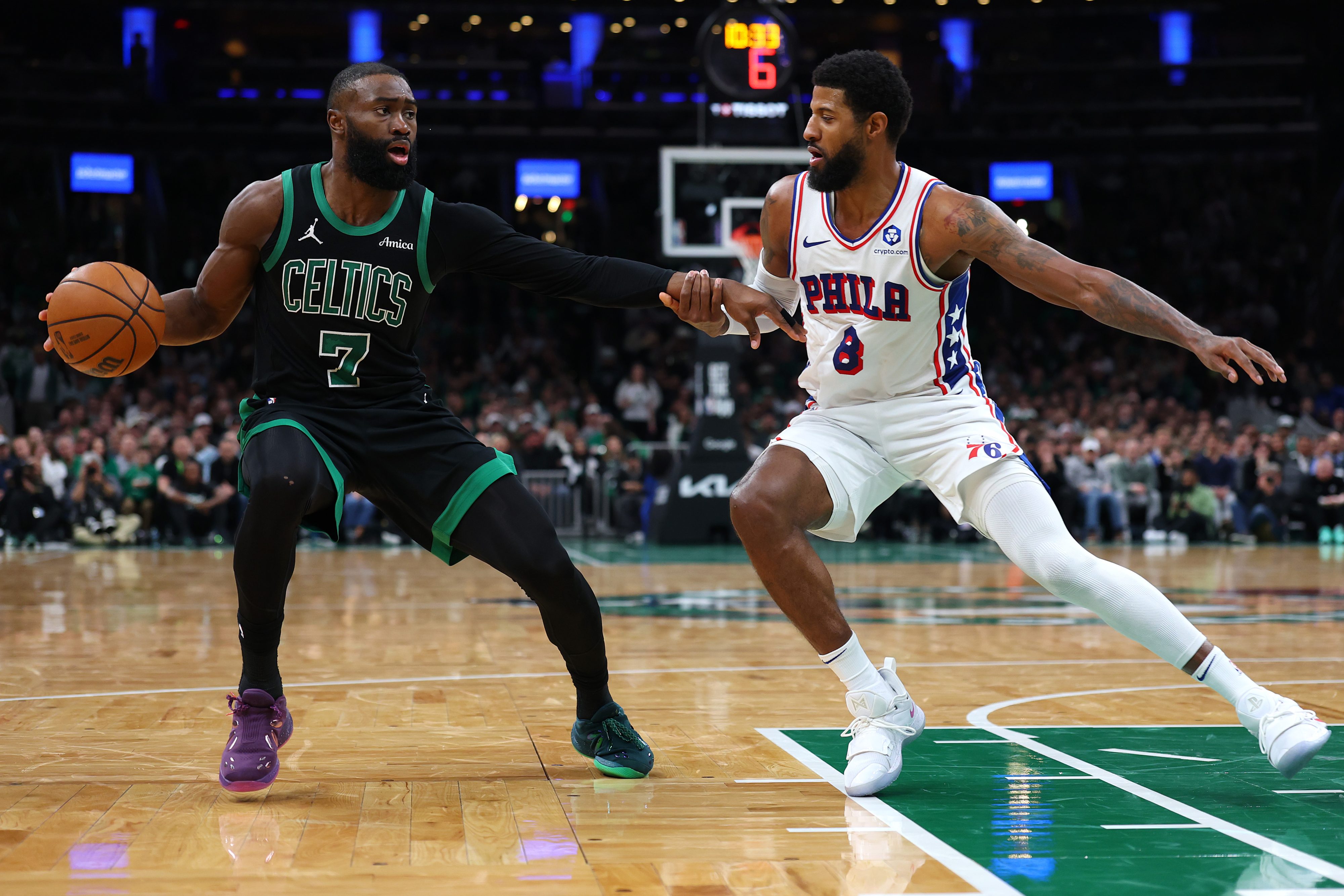 Paul George #8 of the Philadelphia 76ers defends Jaylen Brown #7 of the Boston Celtics during the second half of Game Five