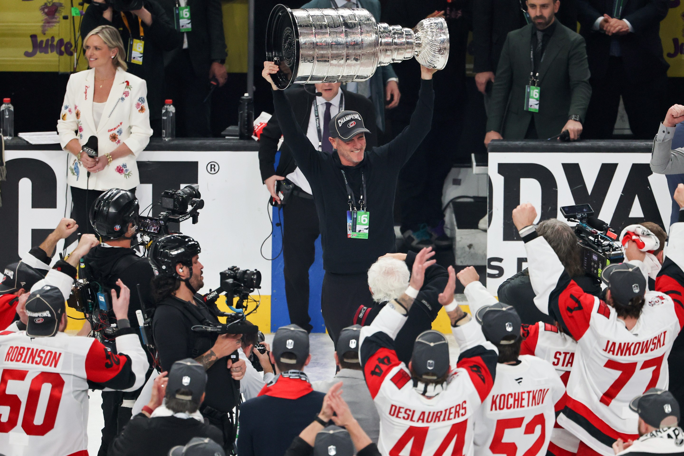 LAS VEGAS, NEVADA - JUNE 14: CEO, owner and governor Tom Dundon of the Carolina Hurricanes hoists the Stanley Cup after the team's 3-0 victory over the Vegas Golden Knights in Game Six of the 2026 NHL Stanley Cup Final at T-Mobile Arena on June 14, 2026 in Las Vegas, Nevada. The Hurricanes won the series four games to two. (Photo by Ethan Miller/Getty Images)