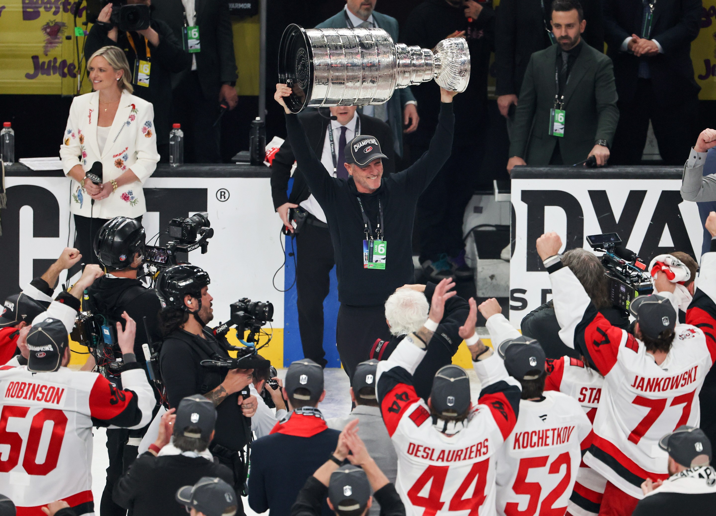 LAS VEGAS, NEVADA - JUNE 14: CEO, owner and governor Tom Dundon of the Carolina Hurricanes hoists the Stanley Cup after the team's 3-0 victory over the Vegas Golden Knights in Game Six of the 2026 NHL Stanley Cup Final at T-Mobile Arena on June 14, 2026 in Las Vegas, Nevada. The Hurricanes won the series four games to two. (Photo by Ethan Miller/Getty Images)