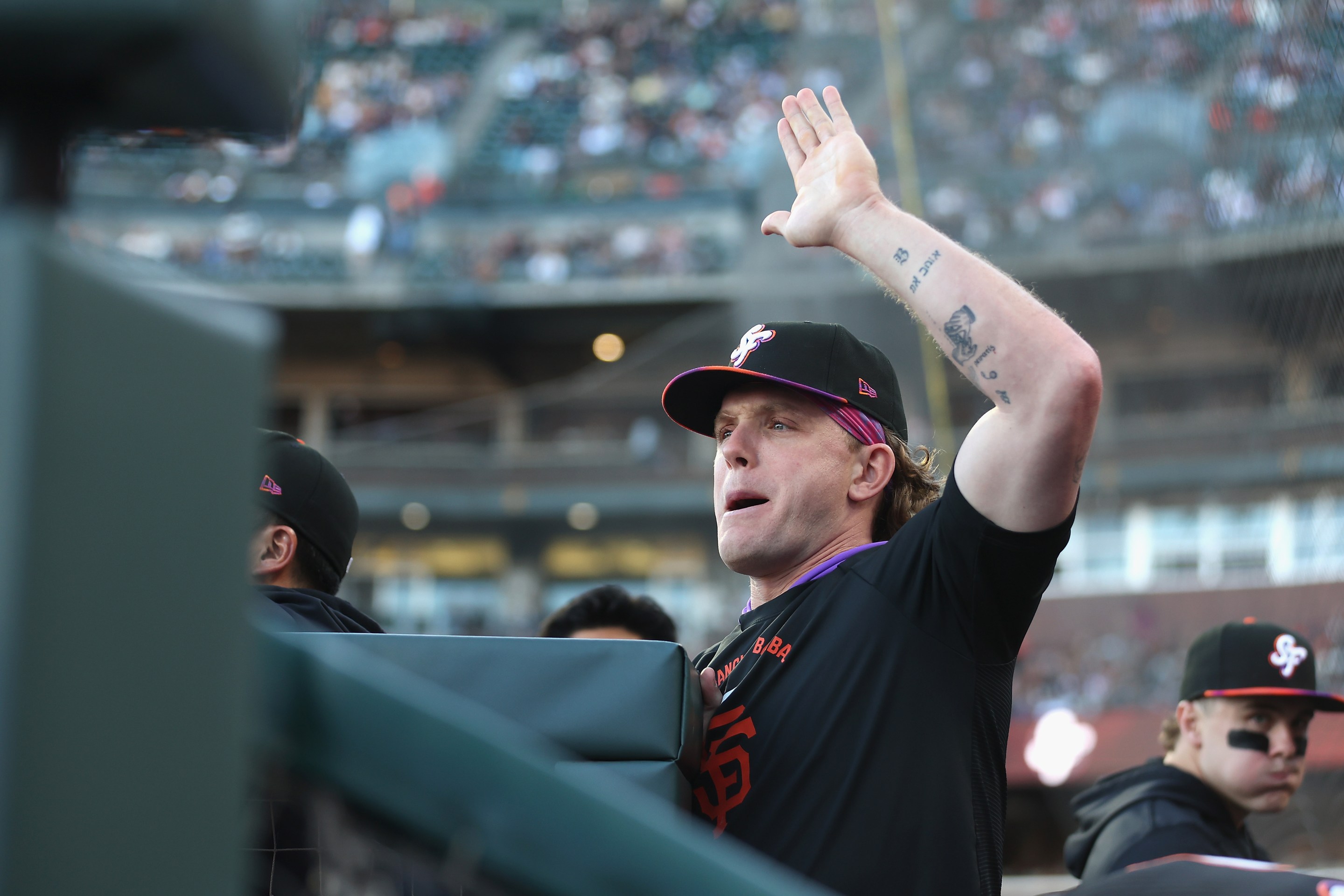 SAN FRANCISCO, CALIFORNIA - JUNE 09: Harrison Bader #9 of the San Francisco Giants welcomes teammates back to the dugout between innings against the Washington Nationals at Oracle Park on June 09, 2026 in San Francisco, California. (Photo by Lachlan Cunningham/Getty Images)
