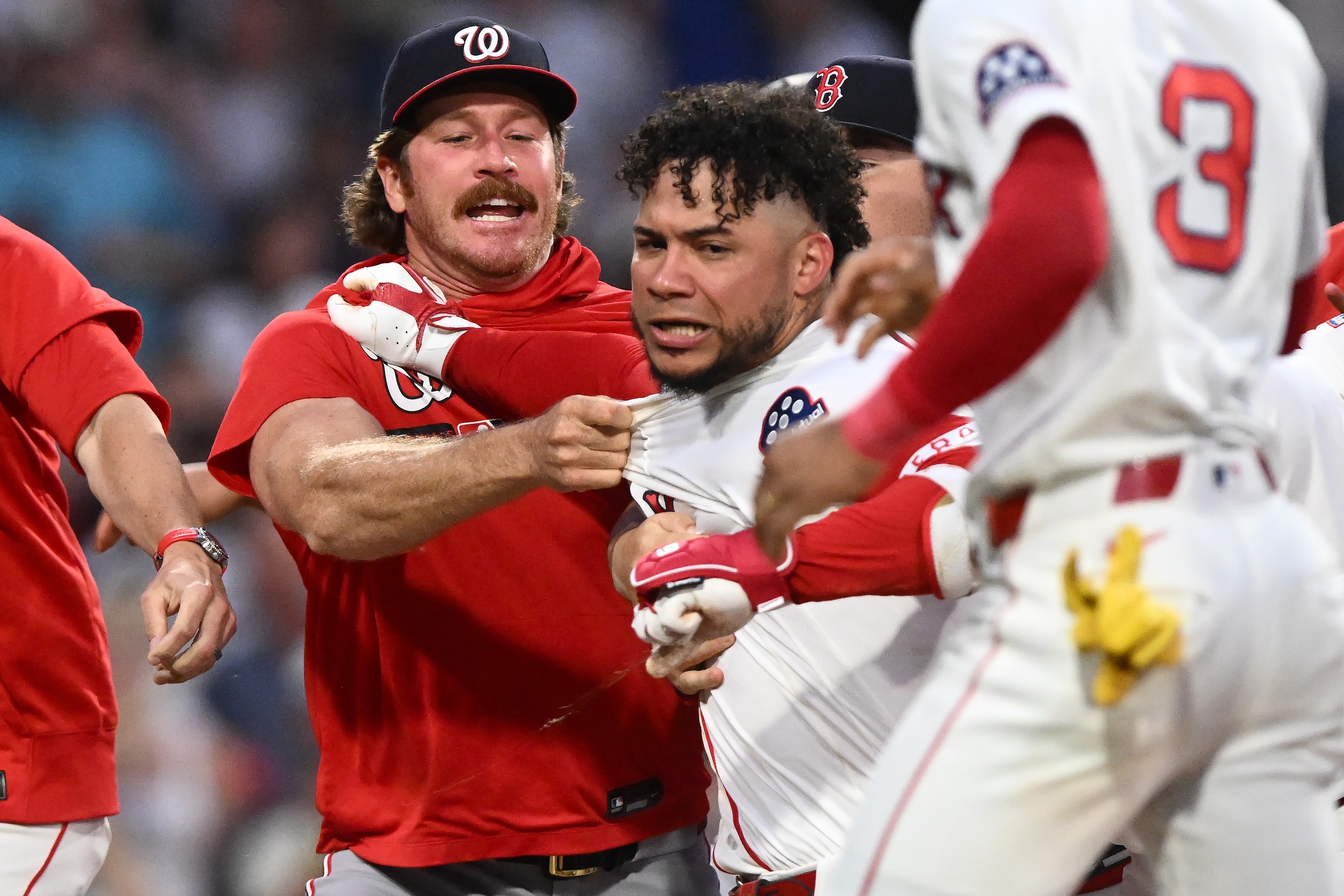 Willson Contreras is restrained by like 11 different dudes.