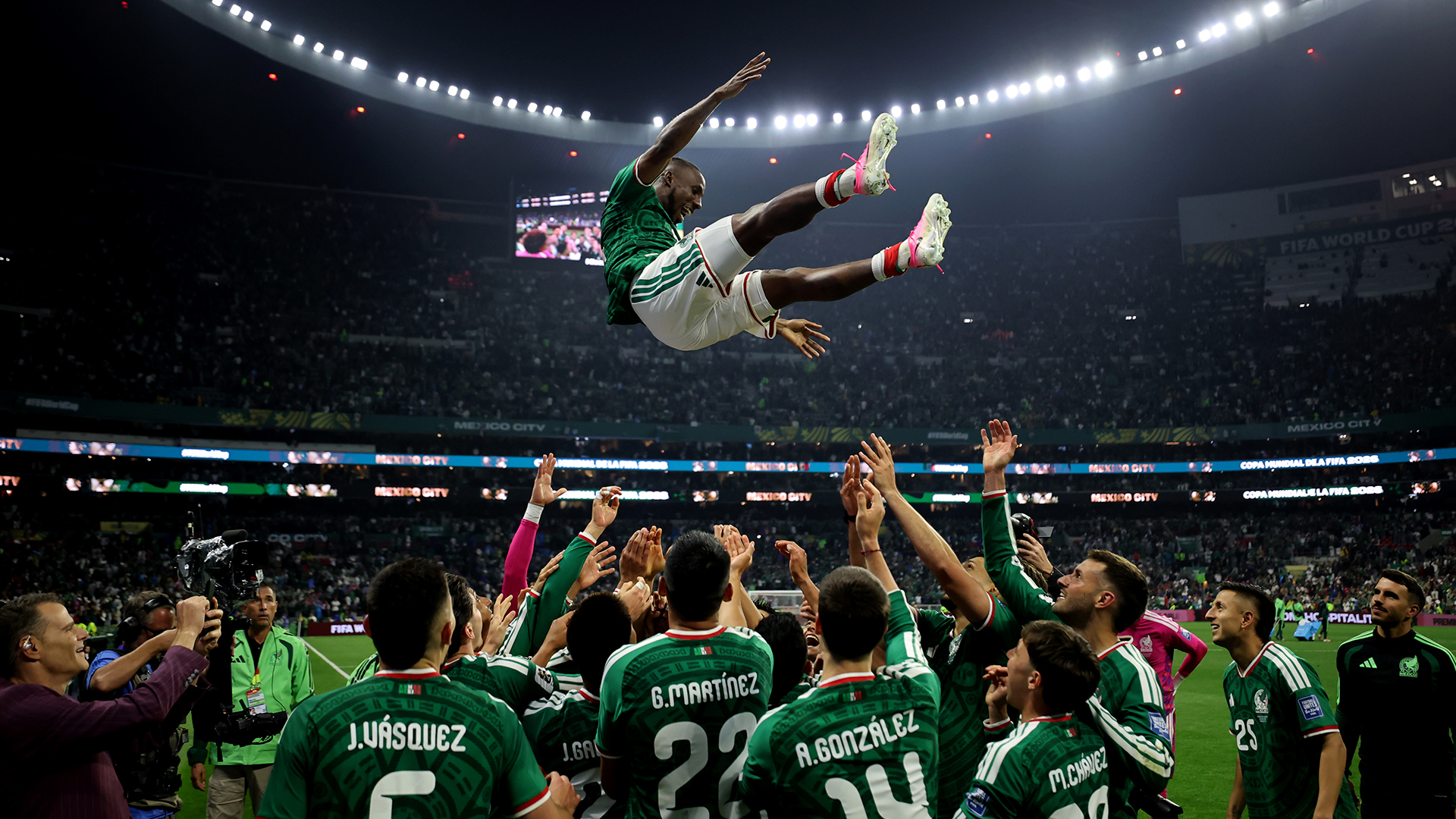 Julian Quinones #16 of Mexico is thrown in the air by team mates as they celebrate after the team's victory and progression to the Round of 16 after the FIFA World Cup 2026 Round Of 32 match between Mexico and Ecuador at Mexico City Stadium on June 30, 2026 in Mexico City, Mexico.