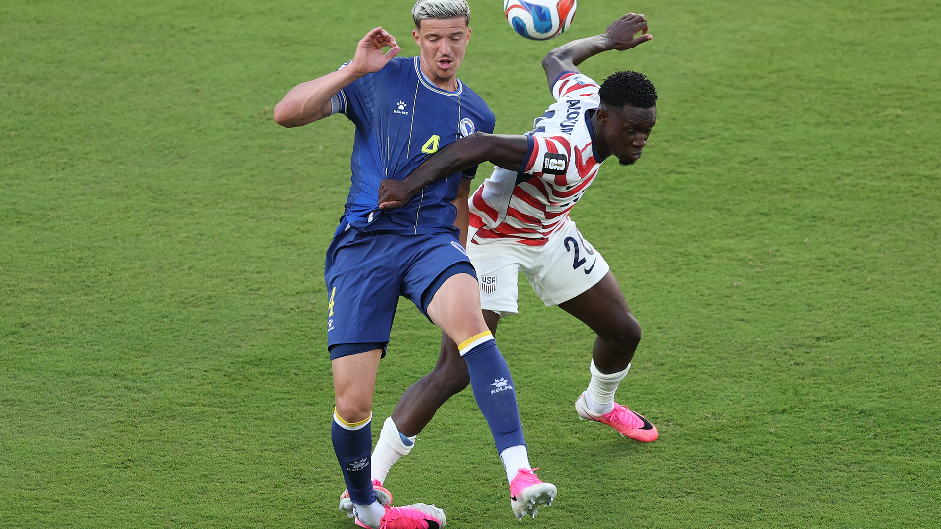 Folarin Balogun #20 of the United States fouls Tarik Muharemovic #4 of Bosnia and Herzegovina which is later reviewed by VAR and awarded as a red card foul a during the FIFA World Cup 2026 Round of 32 match between USA and Bosnia and Herzegovina at San Francisco Bay Area Stadium on July 01, 2026 in Santa Clara, California.