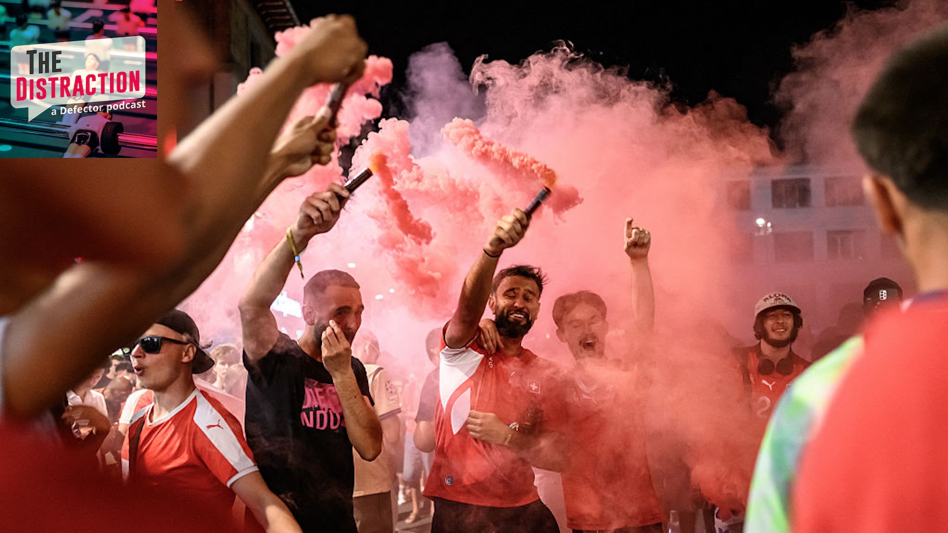 Switzerland supporters celebrate their team's victory with flares