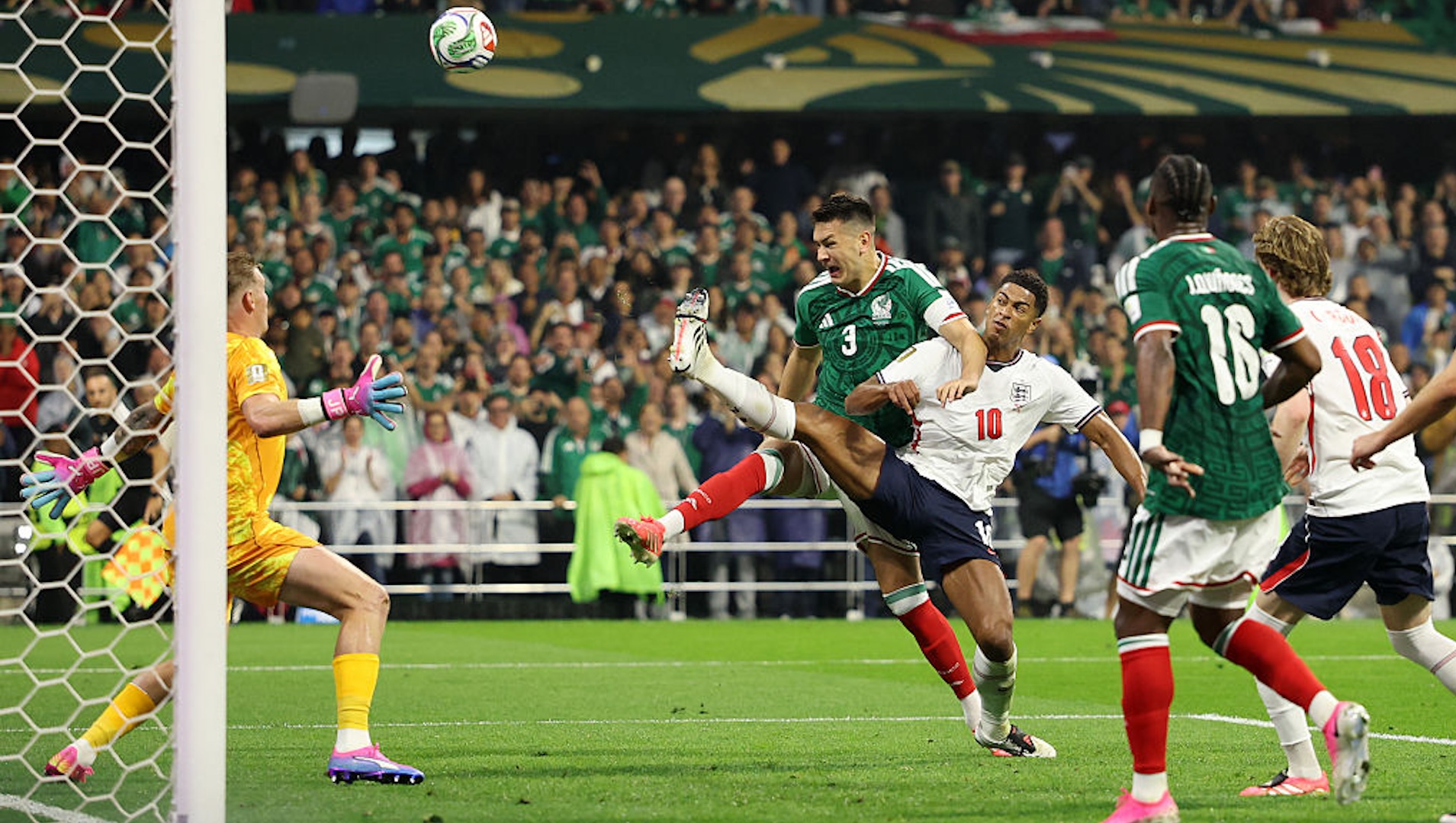 Cesar Montes #3 of Mexico shoots and misses a chance against Jude Bellingham #10 of England