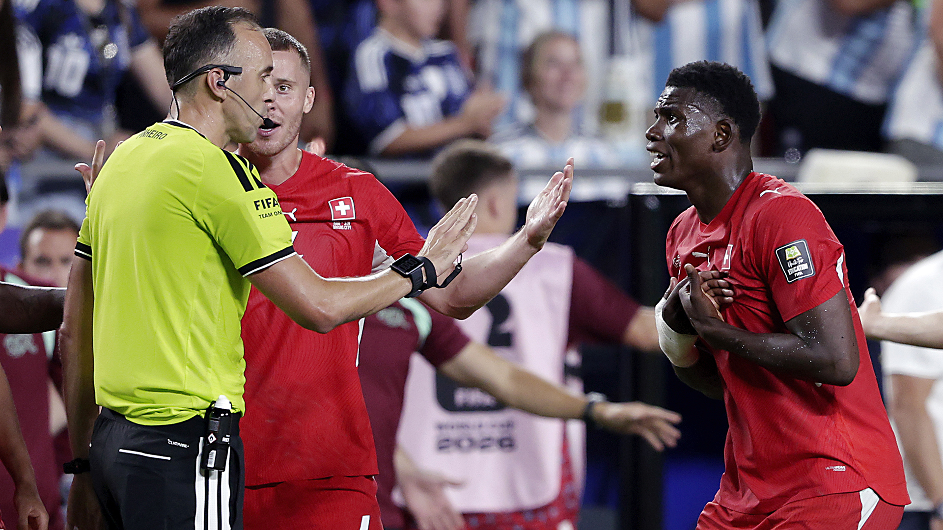 Referee Joao Pedro Silva Pinheiro arguing with Nico Elvedi of Switzerland, Breel Embolo of Switzerland after giving Breel Embolo of Switzerland a red card during the World Cup match between Argentina v Switzerland at the Kansas City Stadium on July 11, 2026 in Kansas City United States