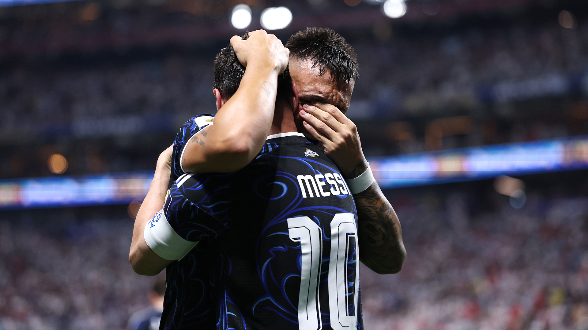 Lautaro Martinez #22 of Argentina celebrates with Lionel Messi #10 after scoring the team's second goal during the FIFA World Cup 2026 Semi Final match between England and Argentina at Atlanta Stadium on July 15, 2026 in Atlanta, Georgia.