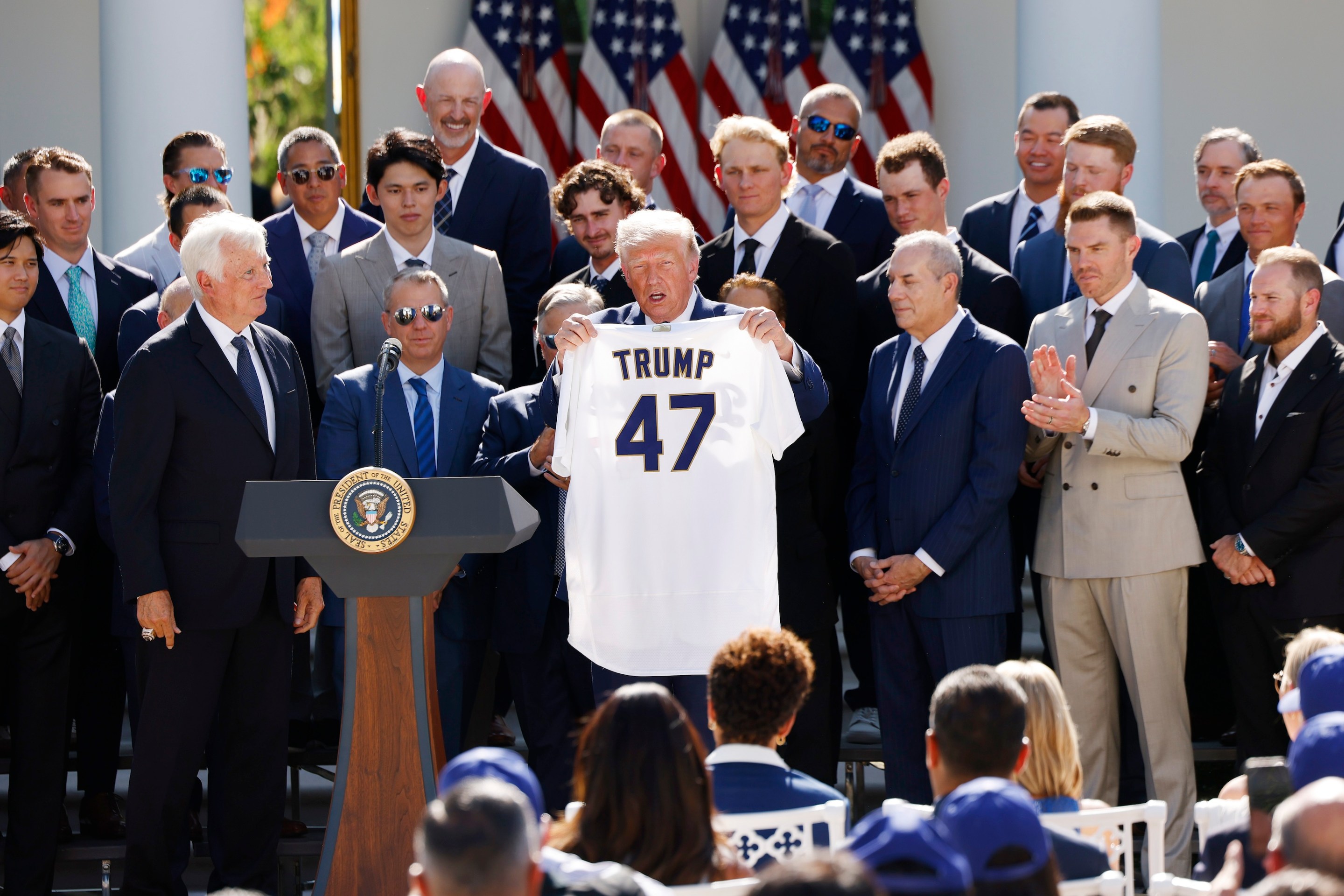 President Donald Trump holds up a Los Angeles Dodgers jersey as he hosted 2025 World Series champions in the Rose Garden of the White House on July 23, 2026 in Washington, DC.