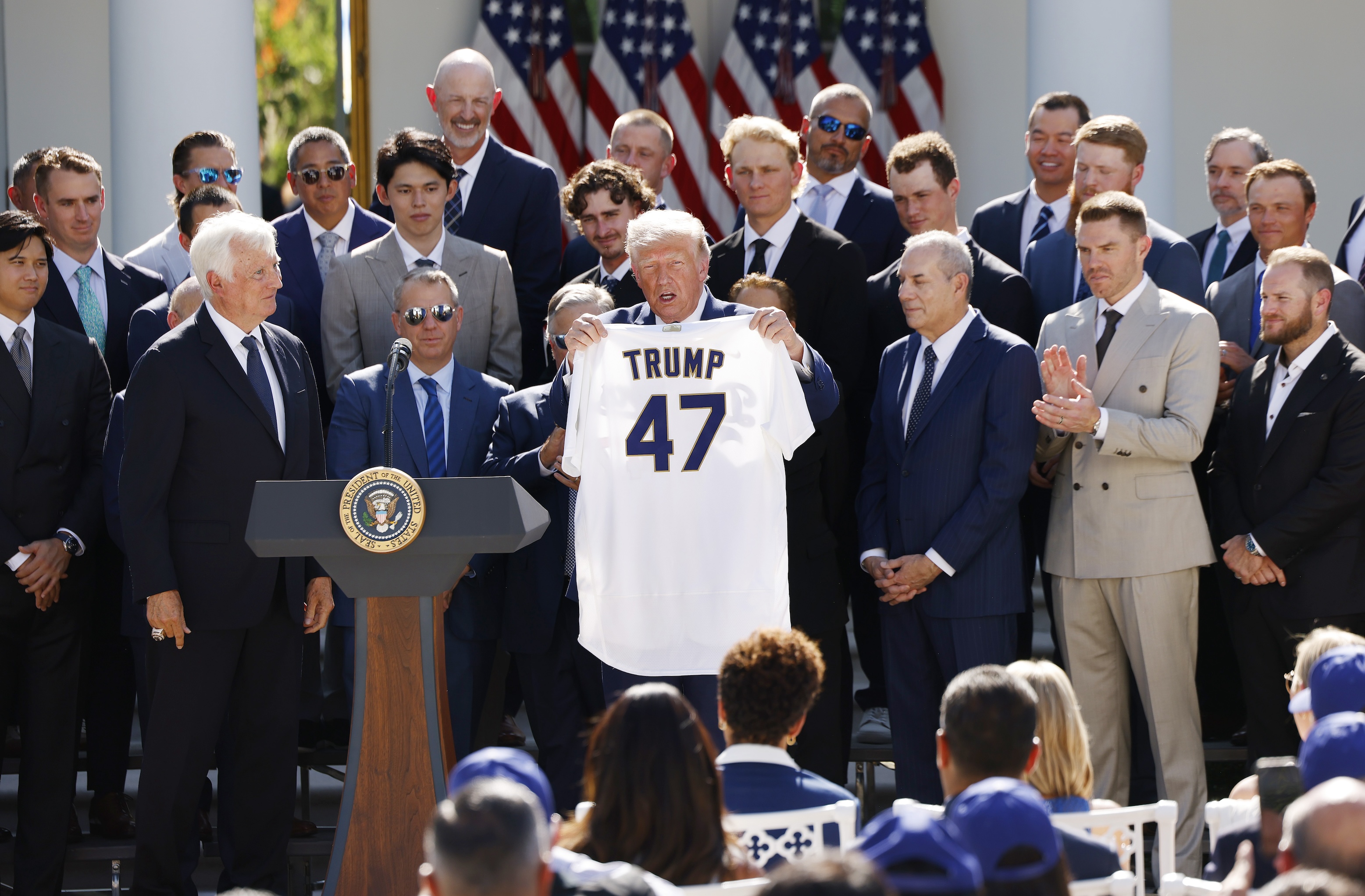 President Donald Trump holds up a Los Angeles Dodgers jersey as he hosted 2025 World Series champions in the Rose Garden of the White House on July 23, 2026 in Washington, DC.