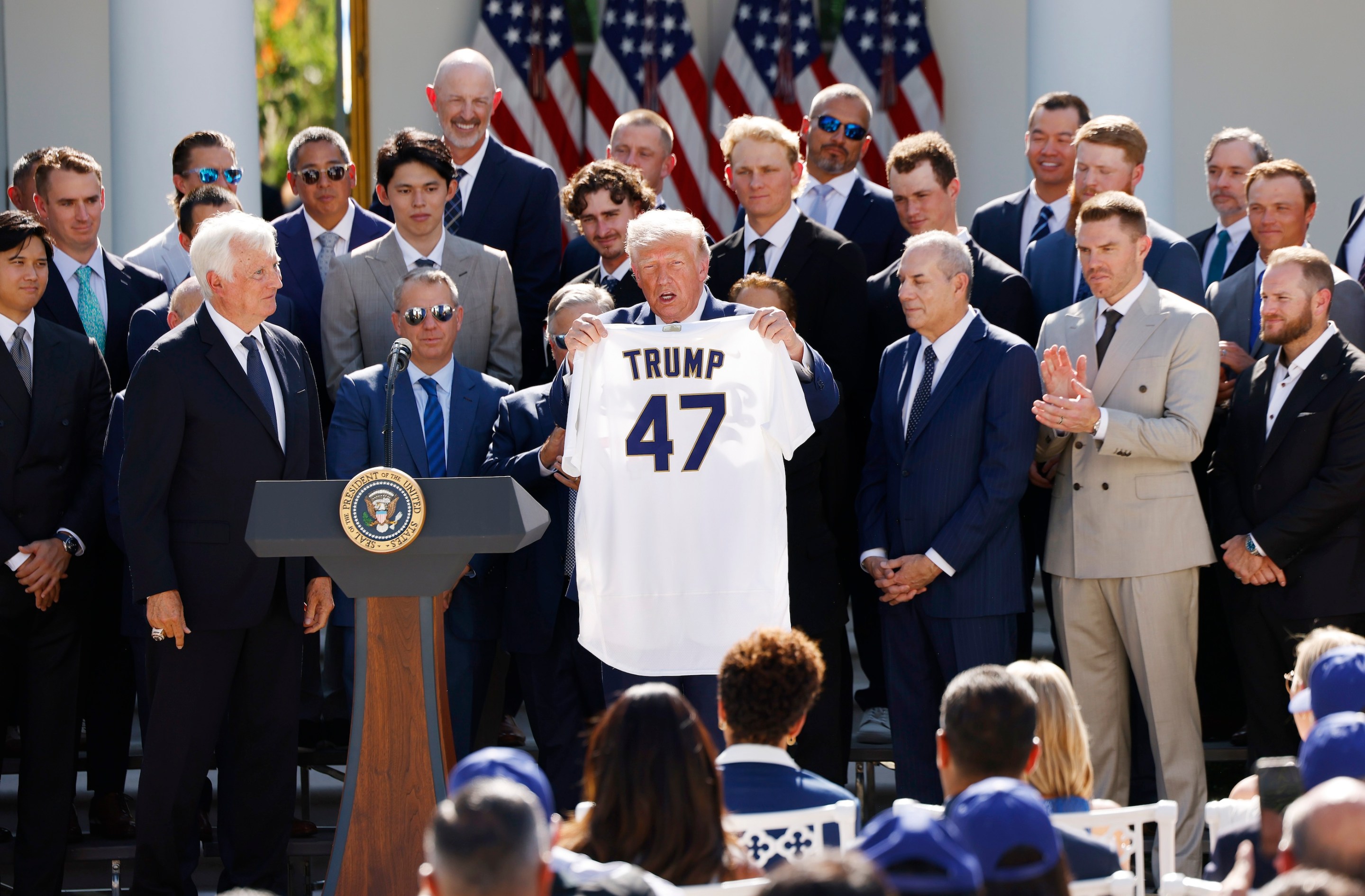 President Donald Trump holds up a Los Angeles Dodgers jersey as he hosted 2025 World Series champions in the Rose Garden of the White House on July 23, 2026 in Washington, DC.