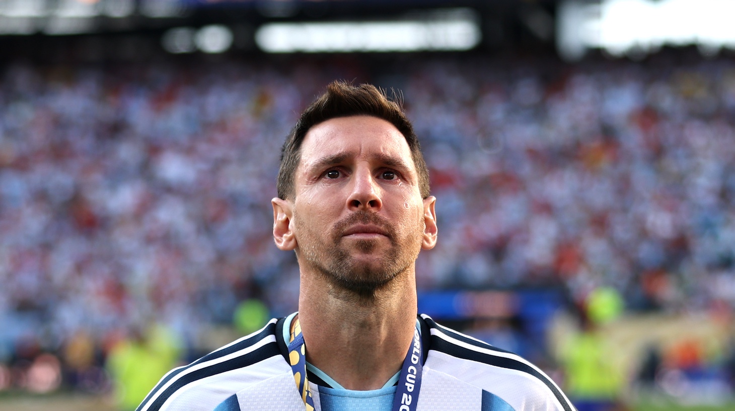 Lionel Messi watches players of Spain receiving the medals following the FIFA World Cup 2026 Final match between Spain and Argentina