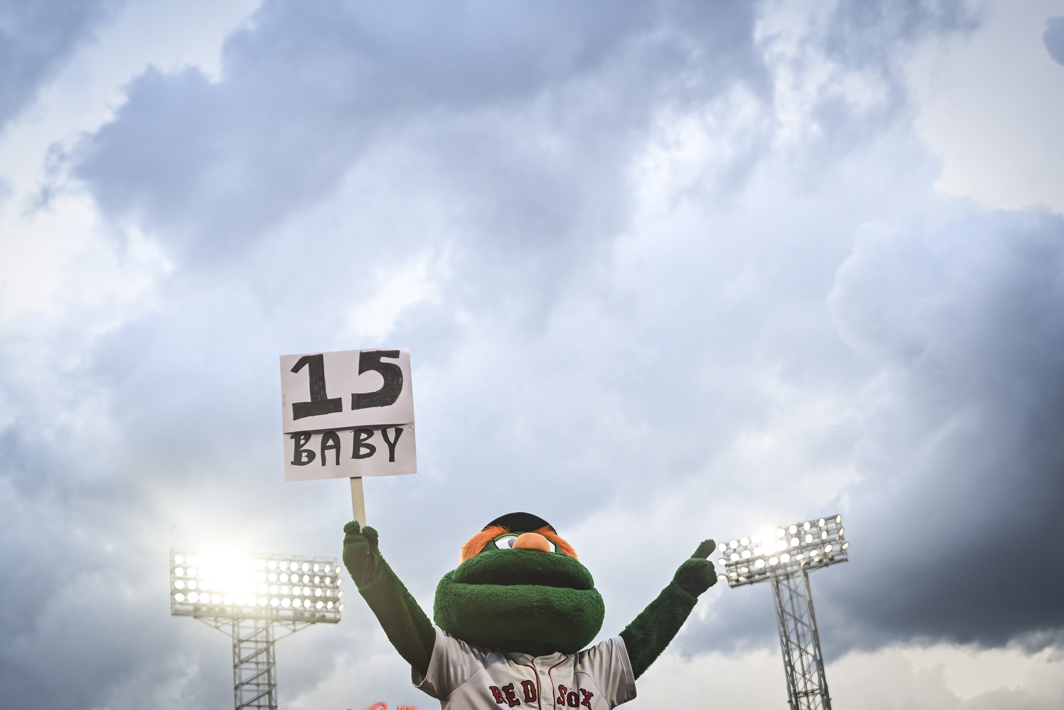 Wally the Green Monster hoists a sign in honor of the Boston Red Sox 15 straight wins