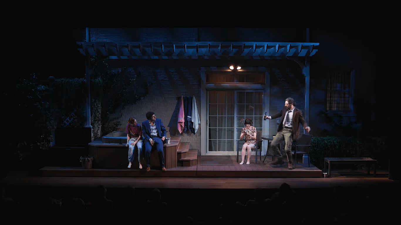 four actors on a set that looks like a dark back porch with a hot tub
