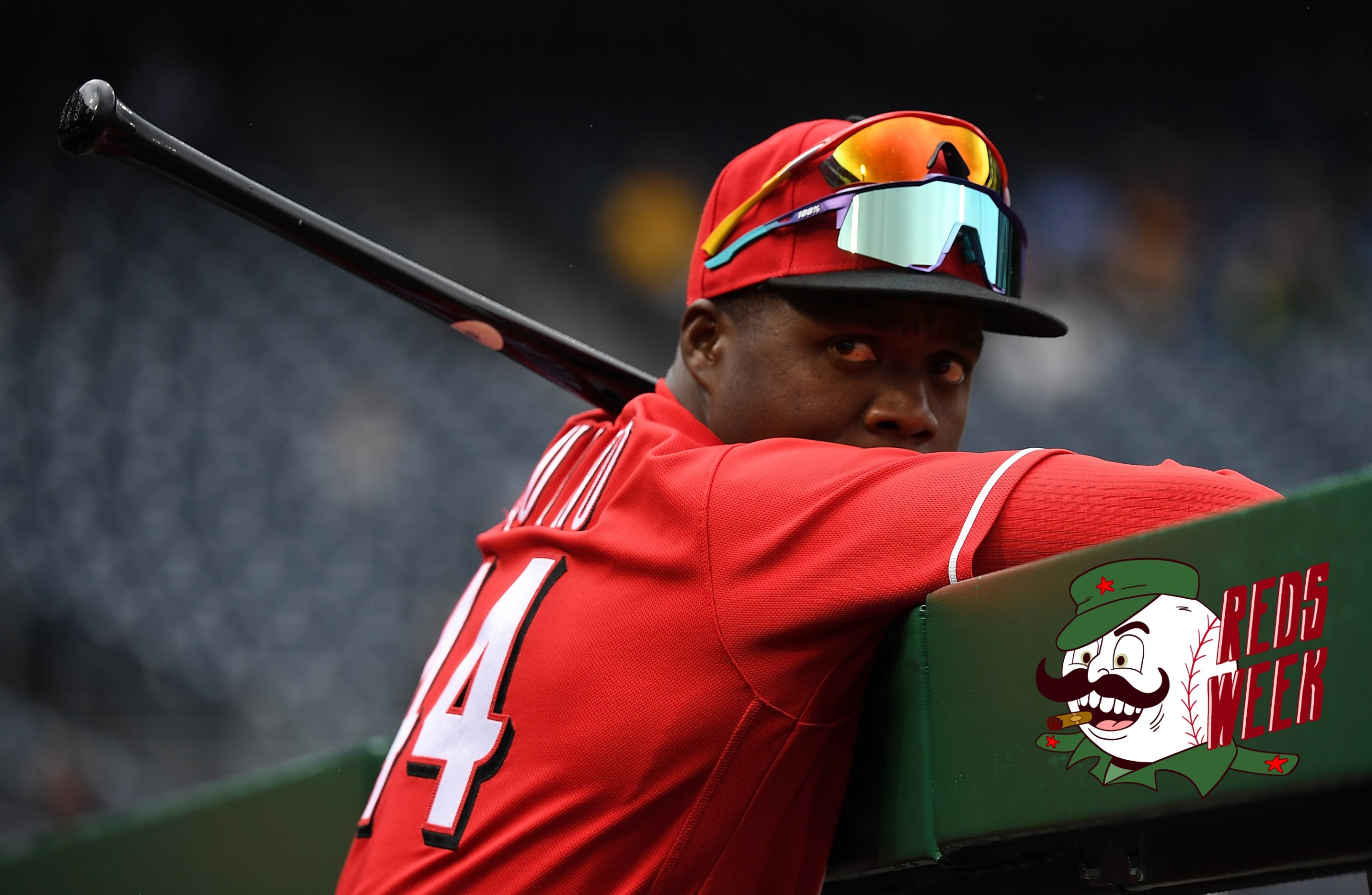 Aristides Aquino of the Cincinnati Reds looks on from the dugout in the eighth inning during the game against the Pittsburgh Pirates at PNC Park on September 28, 2022 in Pittsburgh, Pennsylvania.