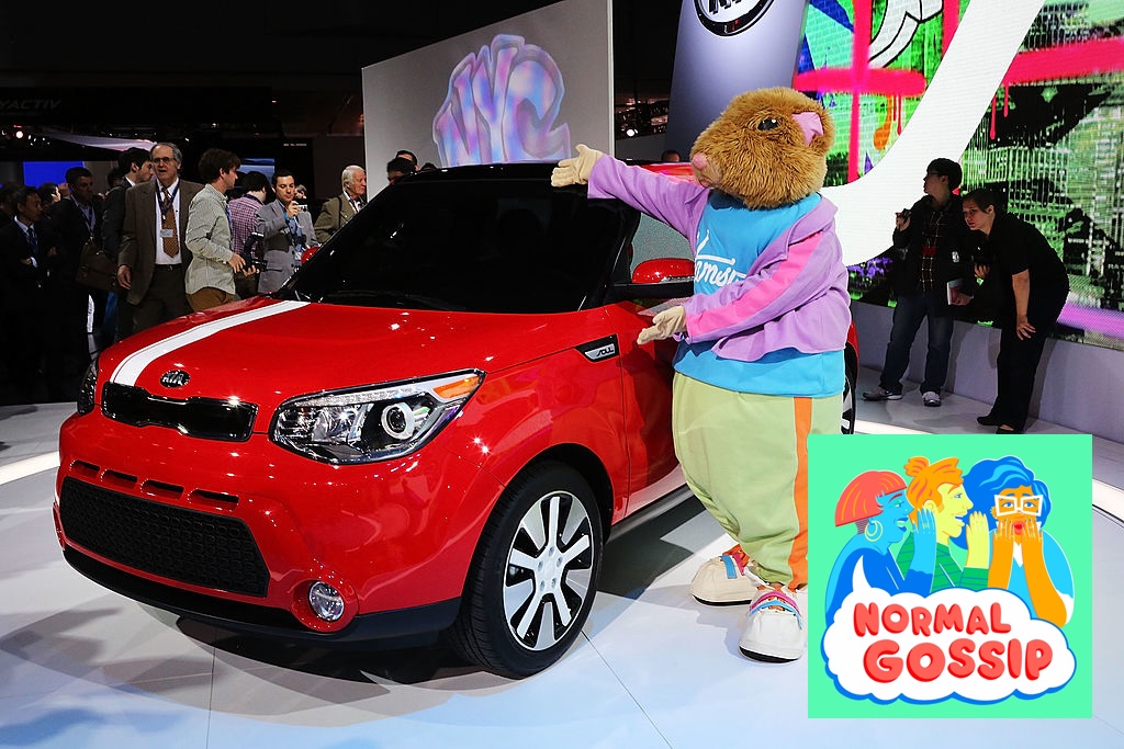 A Kia Soul on display at the New York International Auto Show with a presenter dressed up as a hamster