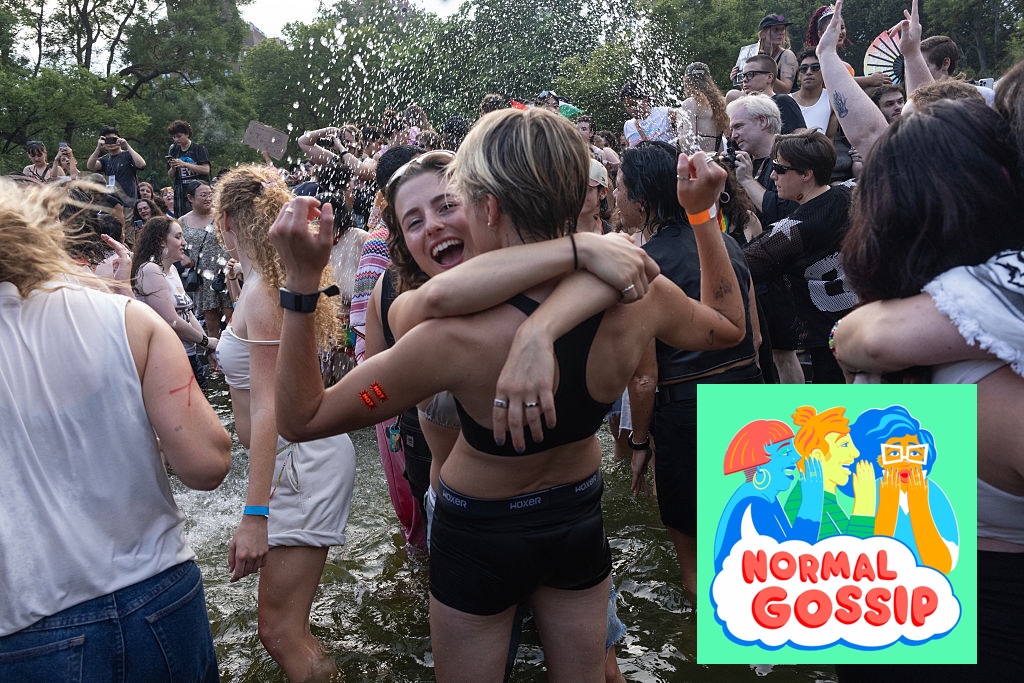 people dance and celebrate pride with on another in the fountain at washington square park in new york during the Dyke March