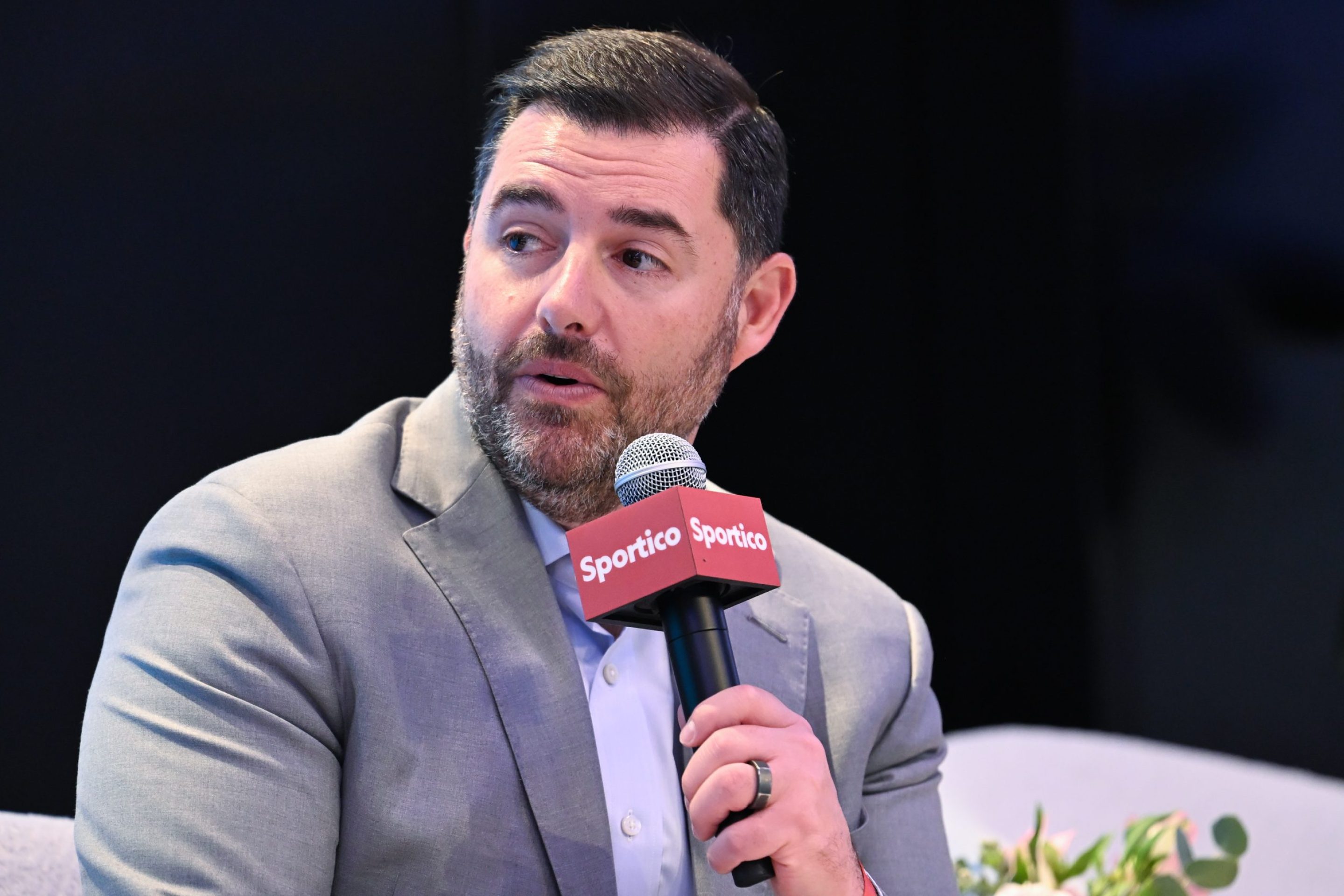 Jed York at Sportico Invest in Sports New York 2025 at Nasdaq HQ on November 04, 2025 in New York, New York. He is sitting down, wearing a suit, and holding a mircrophone.