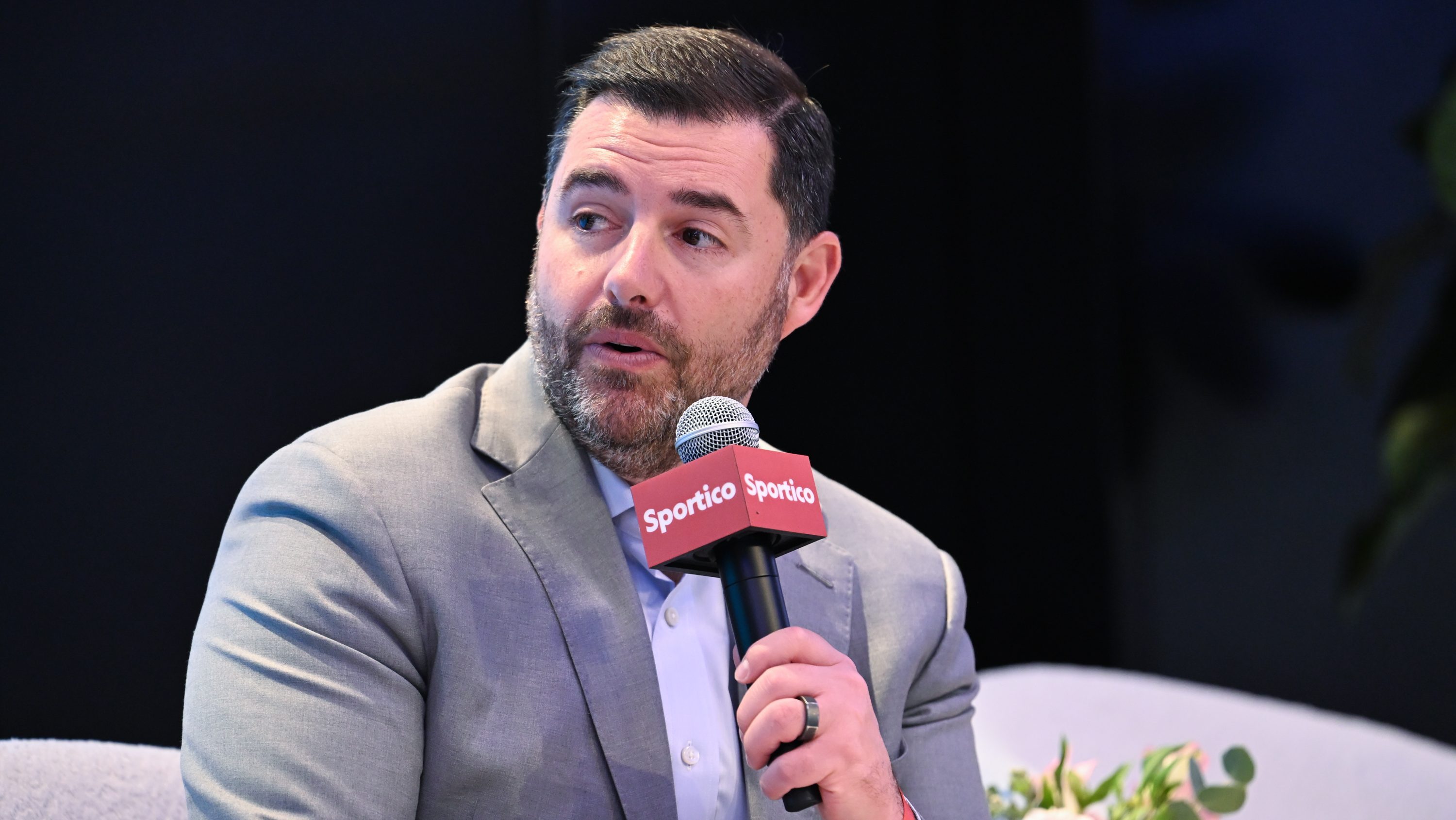 Jed York at Sportico Invest in Sports New York 2025 at Nasdaq HQ on November 04, 2025 in New York, New York. He is sitting down, wearing a suit, and holding a mircrophone.