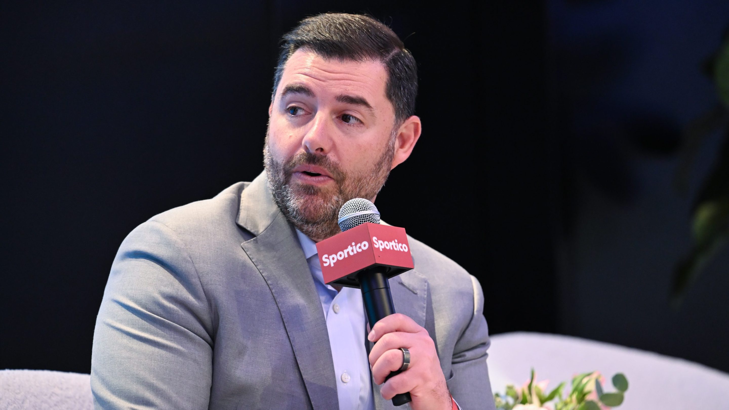 Jed York at Sportico Invest in Sports New York 2025 at Nasdaq HQ on November 04, 2025 in New York, New York. He is sitting down, wearing a suit, and holding a mircrophone.