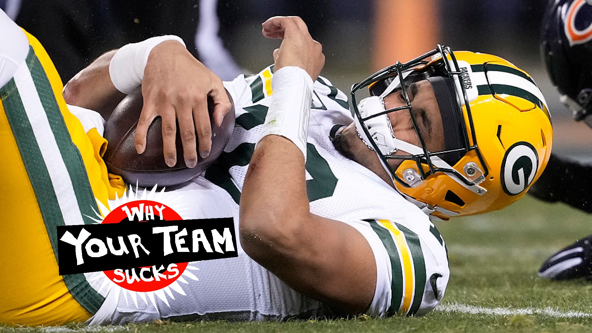 Jordan Love #10 of the Green Bay Packers reacts after being hit during the second quarter against the Chicago Bears at Soldier Field