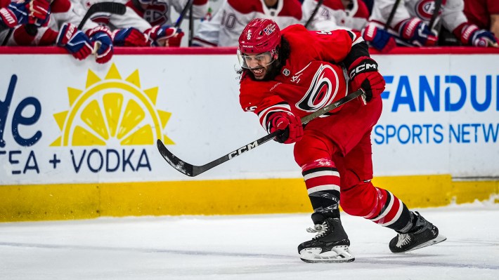 Jalen Chatfield #5 of the Carolina Hurricanes shoots the puck during the first period against the Montréal Canadiens at Lenovo Center on March 29, 2026 in Raleigh, North Carolina.