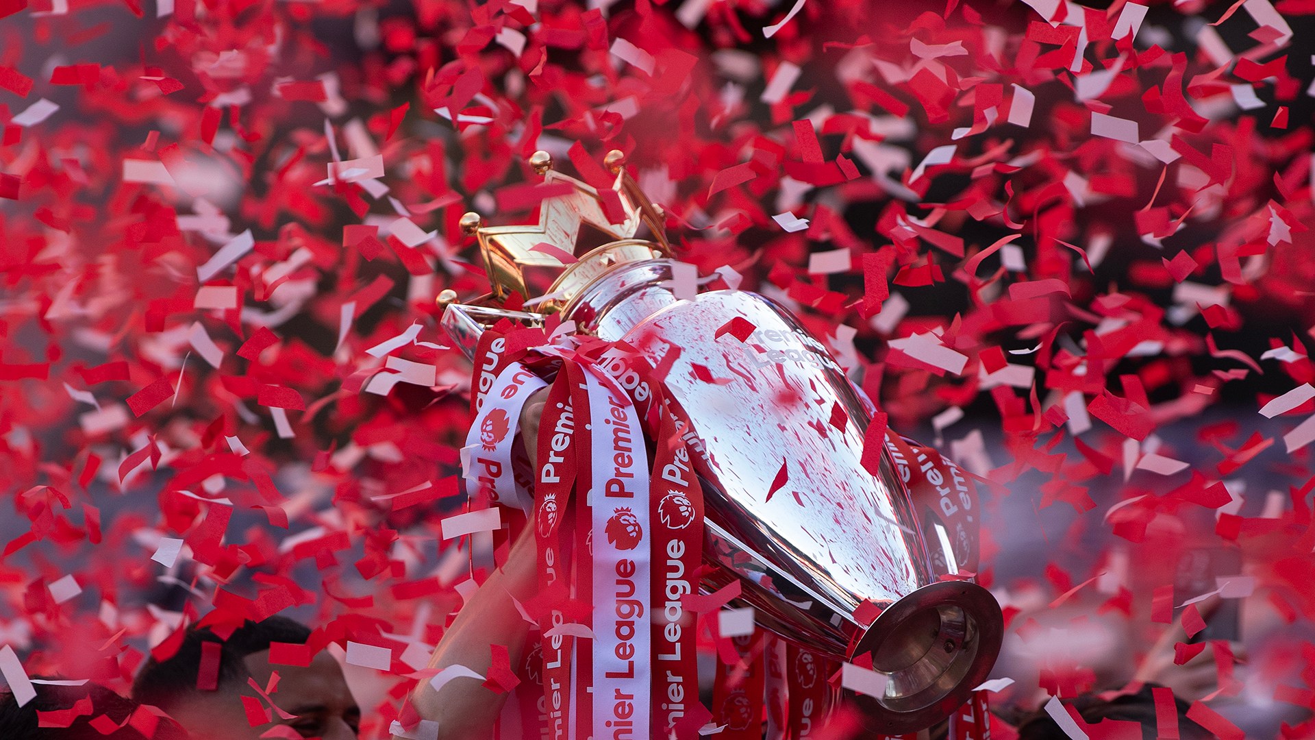 Martin Odegaard of Arsenal (hidden by ticker tape) celebrates with the Premier League trophy after the Premier League match between Crystal Palace and Arsenal at Selhurst Park on May 24, 2026 in London, England.