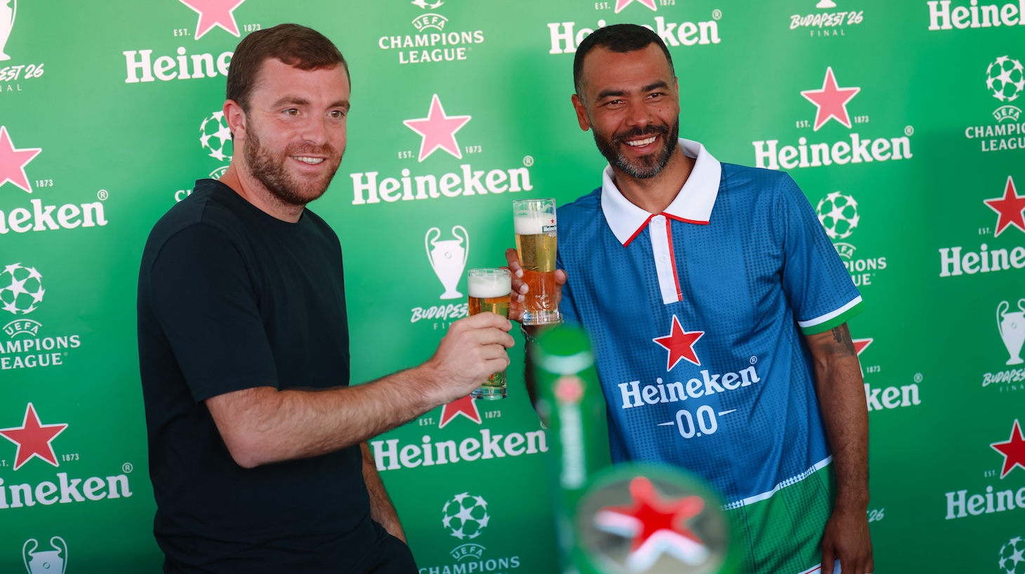 Former player Ashley Cole of England and Fabrizio Romano are seen at the Heineken booth during the UEFA Champions League Final 2026 in Budapest, Hungary.